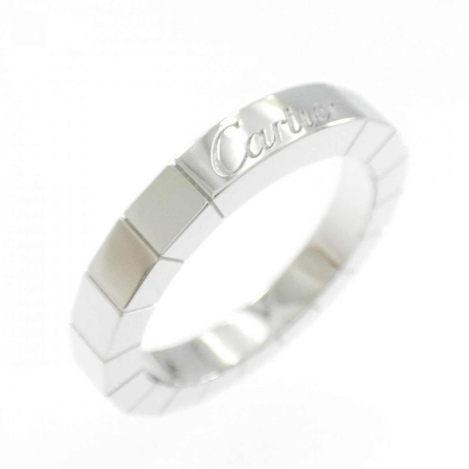 White Gold Band Ring by Cartier: White Gold Band Ring by Cartier White Gold Band Ring by Cartier, featuring a classic design in premium white gold, with a few traces of usage visible. The ring bears a signature and is made from