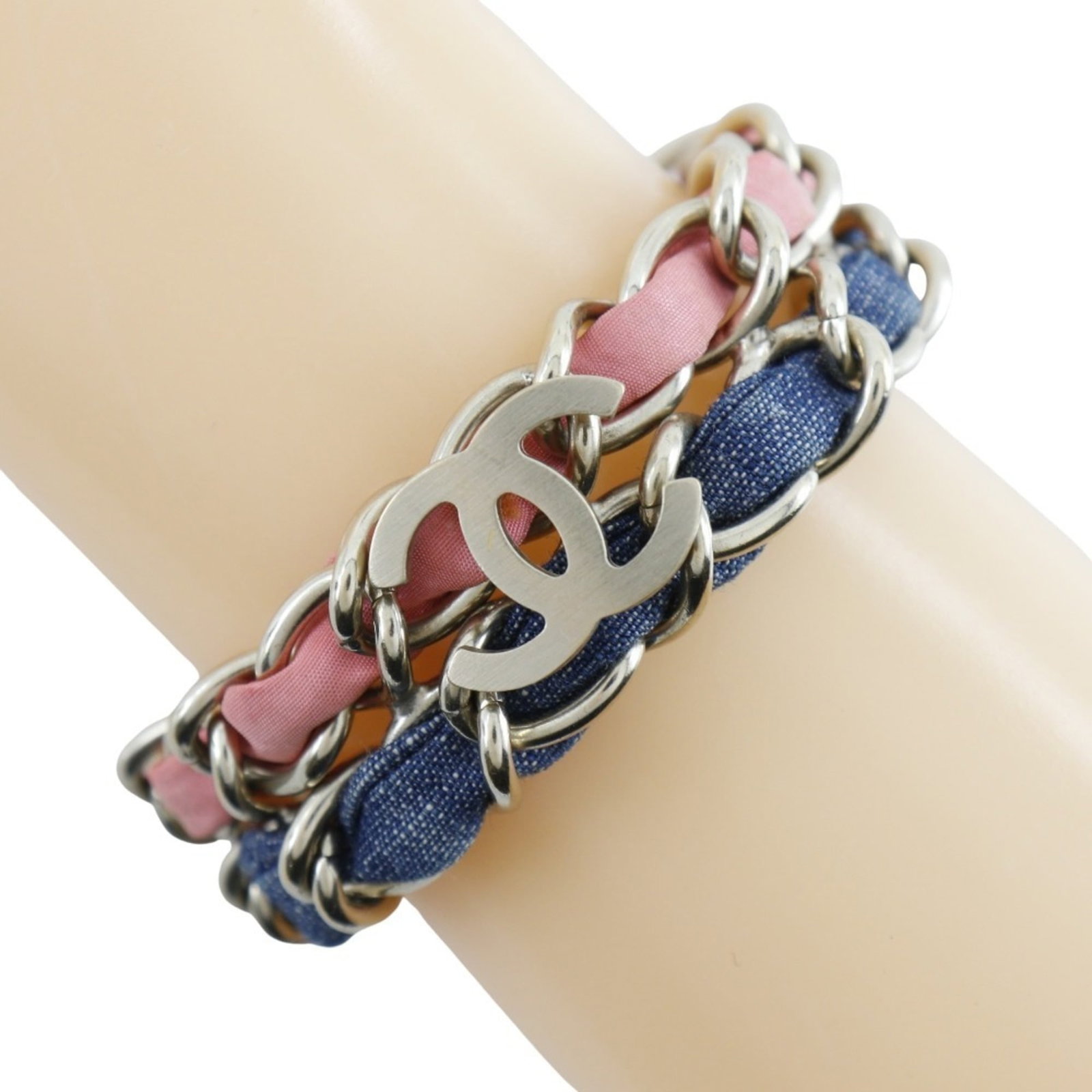Charm of Chanel: Charm of Chanel Charm of Chanel in blue and pink hues, adorned with silver accents, adds a touch of elegance to any outfit. Measuring 17cm in length, this charm bracelet features subtle signs of wear,