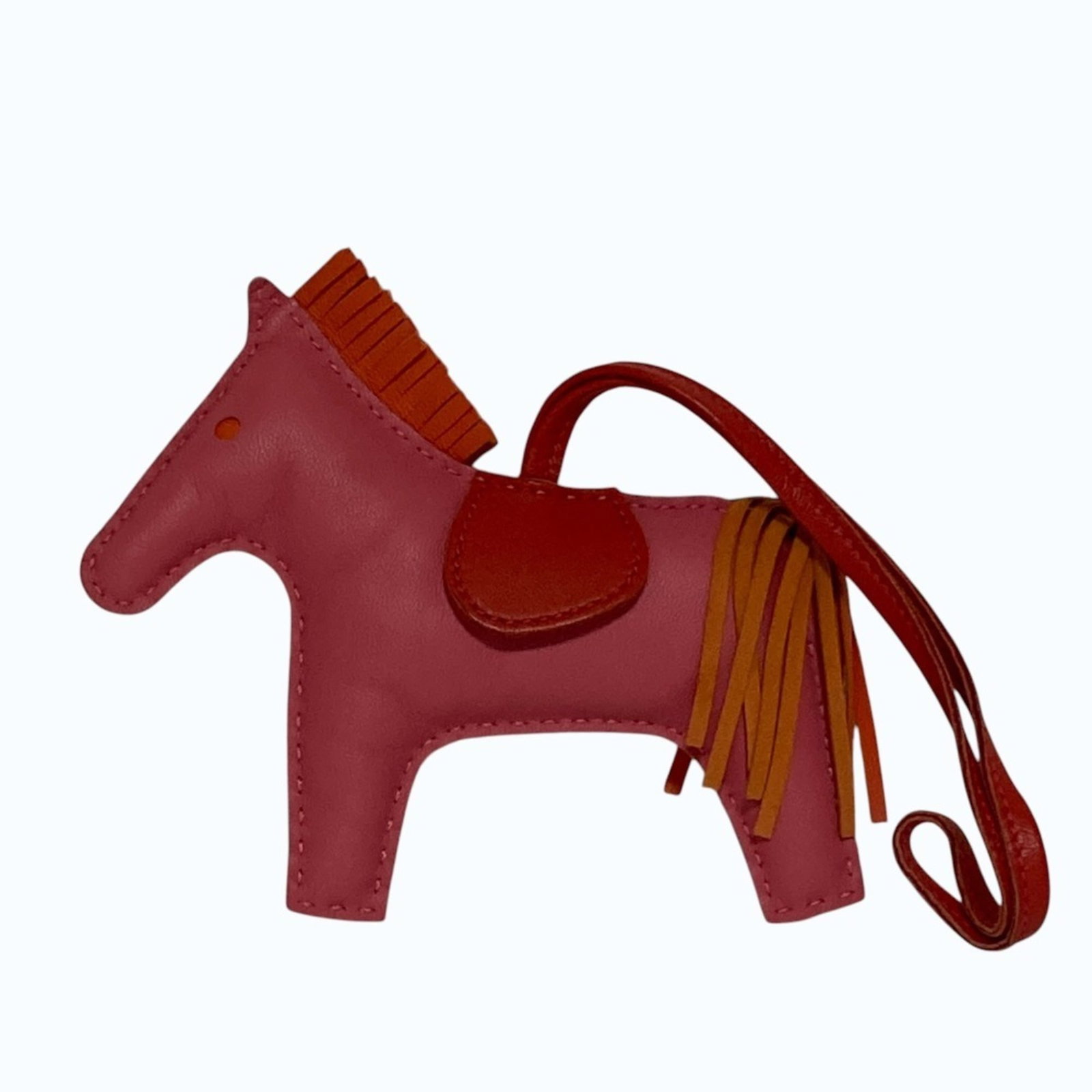 Hermes Handbag Charm Agneau Milo: Hermes Handbag Charm Agneau Milo Agneau Milo, the iconic material used in this Hermes Handbag Charm, adds an air of sophistication and elegance to its design. This charm boasts a size of 120.00mm x 10