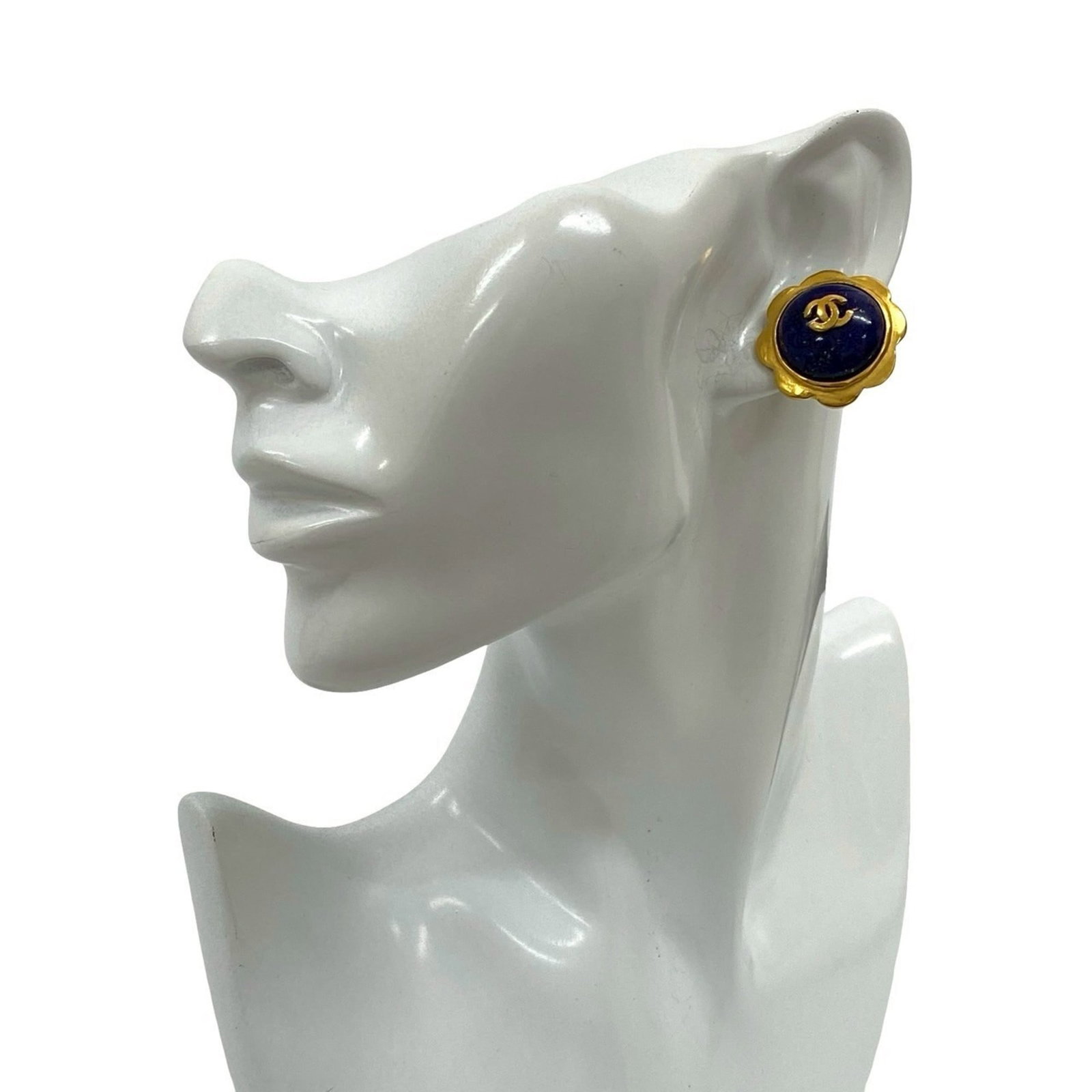 Clip earrings gold plating by Chanel: Clip earrings gold plating by Chanel Clip earrings in gold plating by Chanel, featuring a blue hue. The item measures 25mm x 25mm and has undergone normal wear, with visible scratches and dirt. In goo