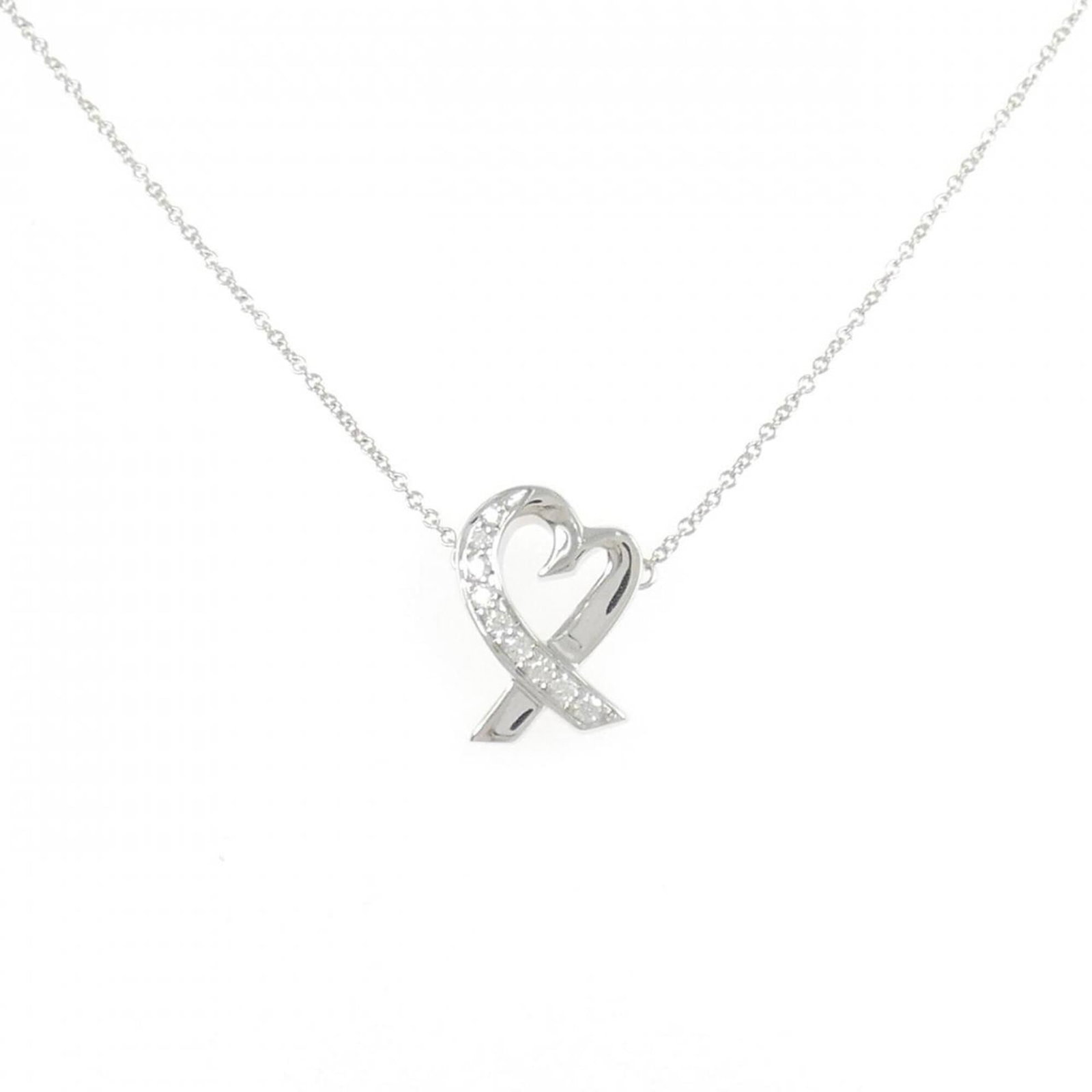Loving Heart Necklace: Loving Heart Necklace Loving Heart Necklace features a stunning white gold (18K) pendant adorned with a diamond, set against a sleek background. The necklace boasts a classic design with a 41 cm circu