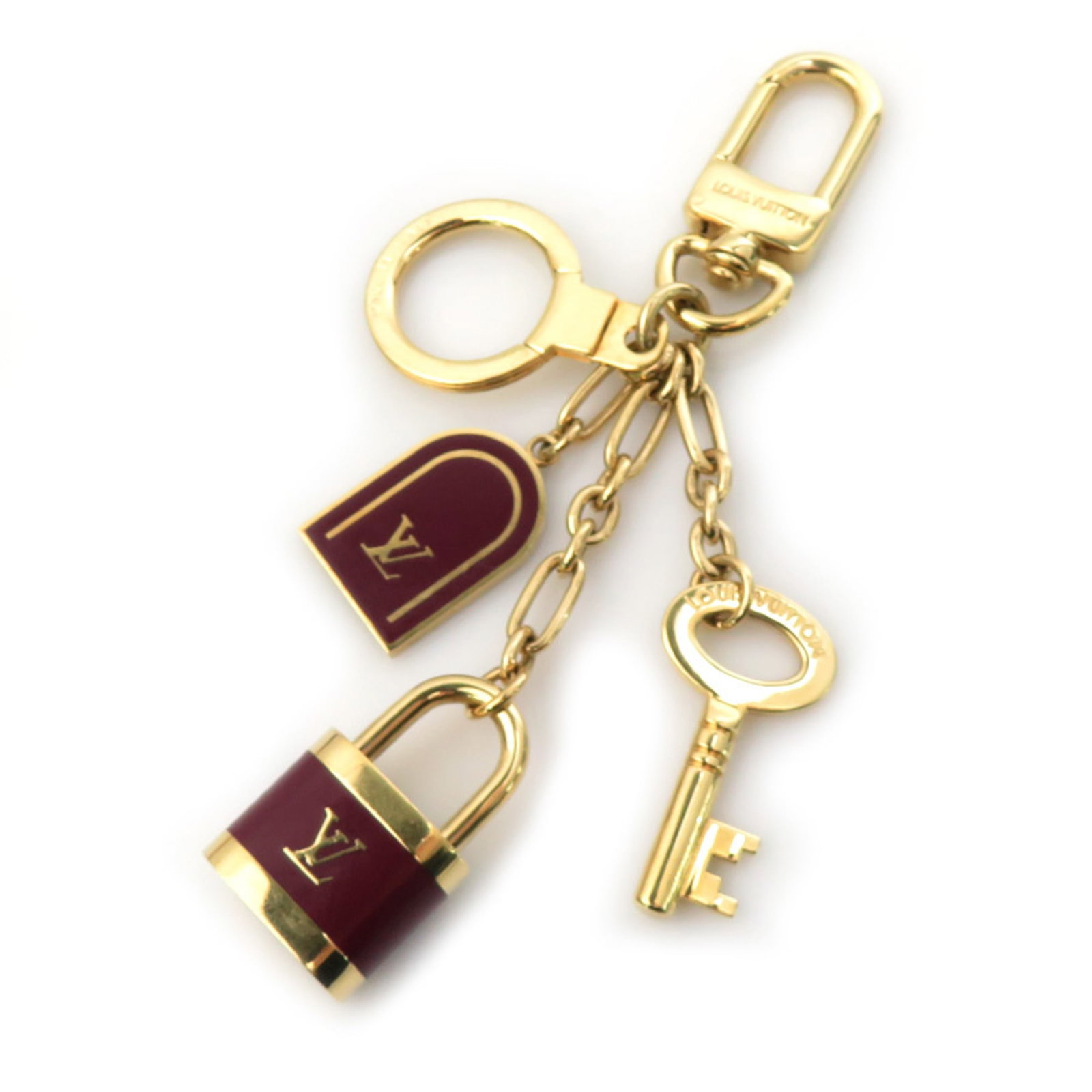 Handbag Charm Metal Enamel Hermes: Handbag Charm Metal Enamel Hermes Bordeaux and gold come together in a striking metal enamel charm, bearing the iconic Hermes logo. This used handbag charm has traces of usage and minor scratches but 