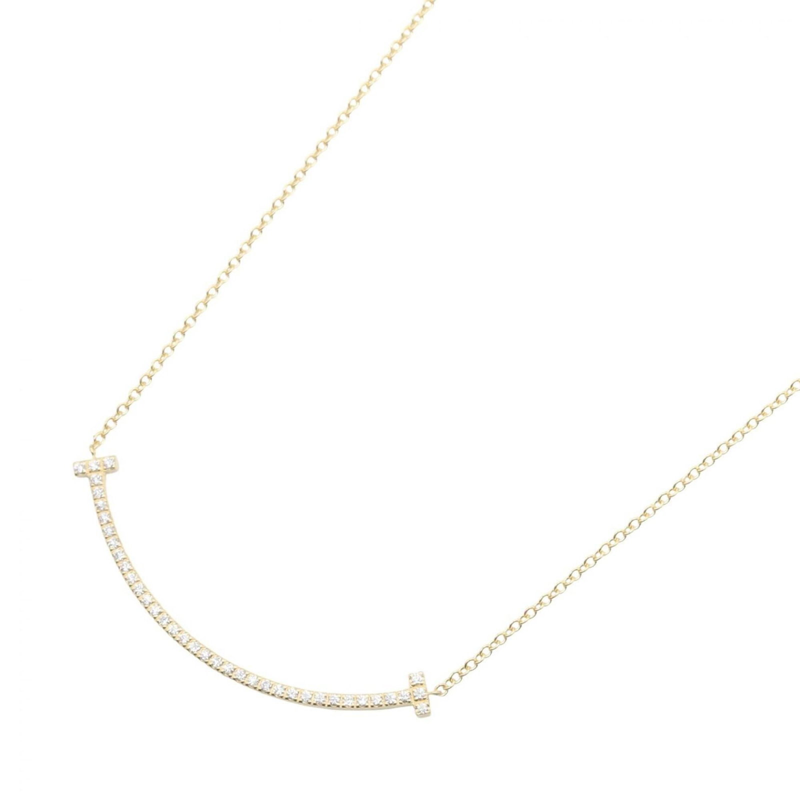 Tiffany & Co. T Smile Small Diamond Necklace 18K (Yellow Gold) Women'S Gold Tone Clear Tone: Tiffany & Co. T Smile Small Diamond Necklace 18K (Yellow Gold) Women'S Gold Tone Clear Tone Tiffany & Co.'s T Smile Small Diamond Necklace in 18K yellow gold features a clear, gold tone design. The ne