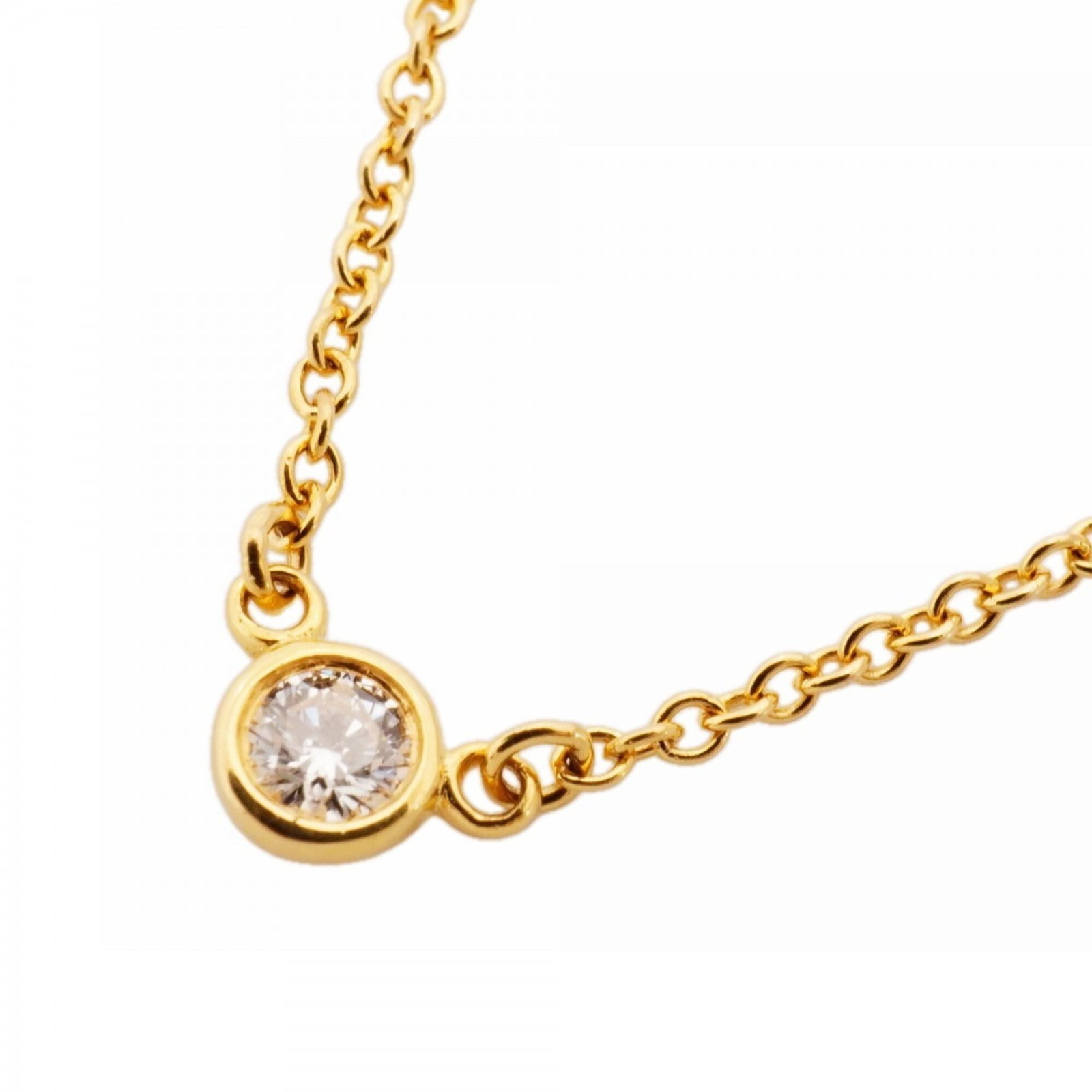 Women's 1Pd 18K Yellow Gold Diamond Necklace By Tiffany: Women's 1Pd 18K Yellow Gold Diamond Necklace By Tiffany 18K yellow gold necklace with a 3.6mm x 5.6mm diamond pendant, crafted by Tiffany. This used necklace features a 41 cm circumference and bears