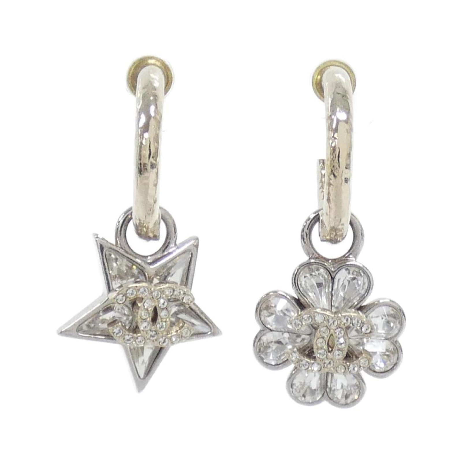 Chanel Stud Earrings: Chanel Stud Earrings Chanel's iconic stud earrings shine in gold and silver, adorned with crystal stones. Measuring 38mm x 19mm, these elegant drops add a touch of sophistication to any outfit. With a