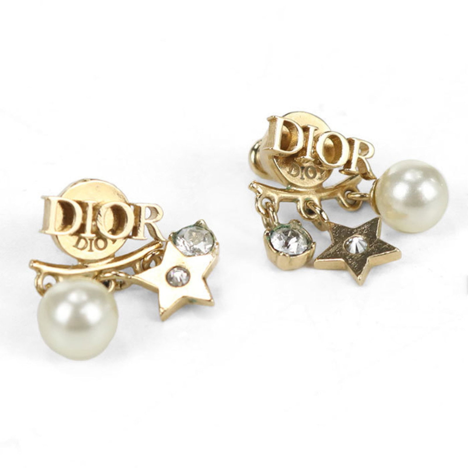 Stud Earrings by Metal from Christian Dior: Stud Earrings by Metal from Christian Dior Stud earrings by Metal from Christian Dior, featuring a gold finish with a few traces of usage visible. The earrings have some minor scratches and dirt but r