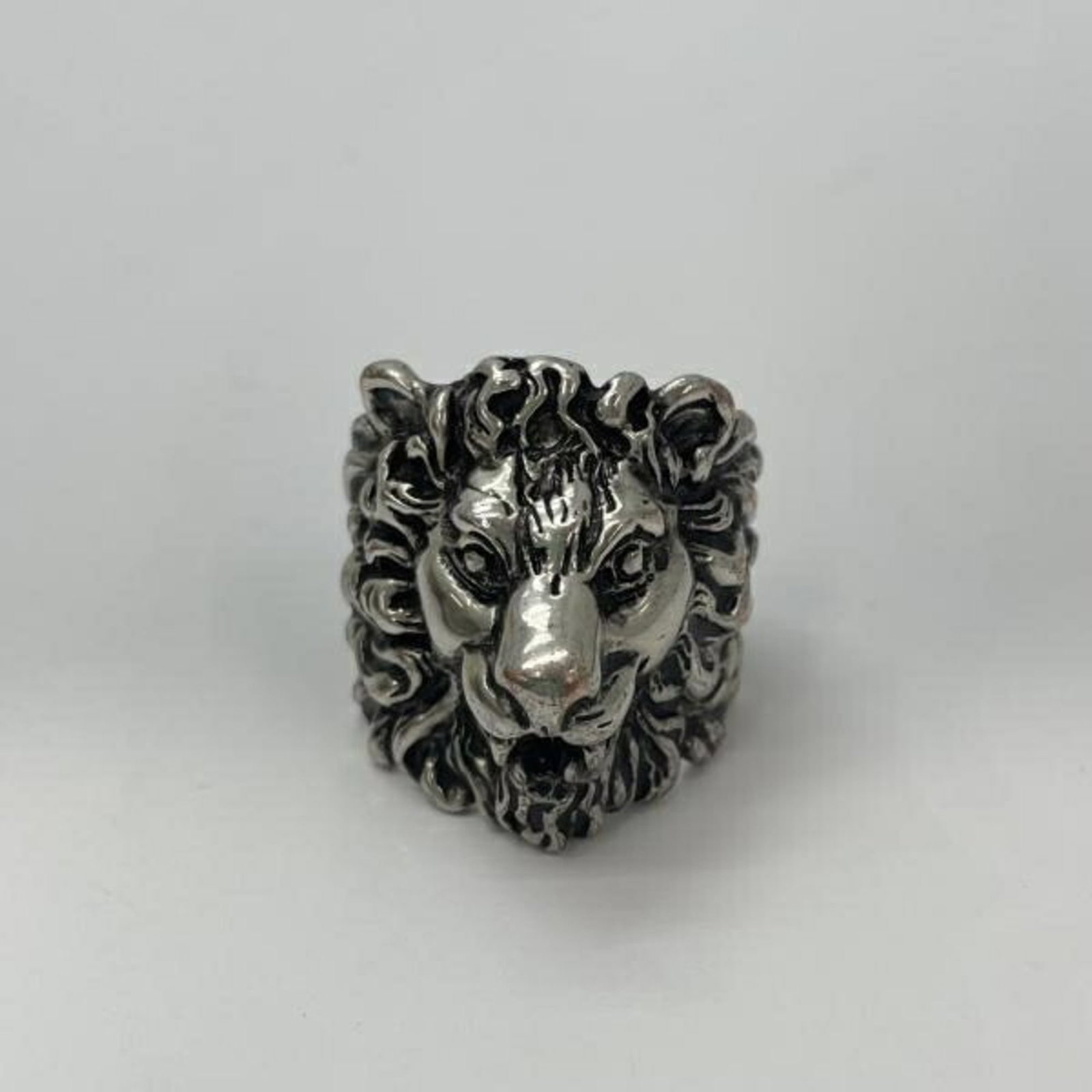 Silver Lion Gucci Ring: Silver Lion Gucci Ring Silver Lion Gucci Ring - A sleek and sophisticated accessory featuring the iconic Silver Lion emblem, this ring showcases Gucci's signature style. With a slight patina from
