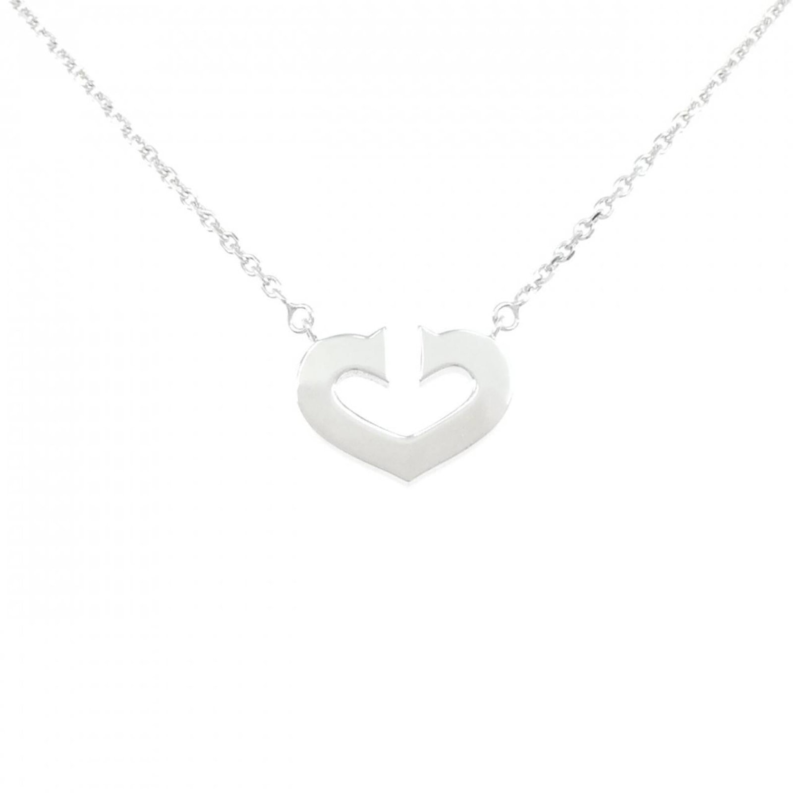 Heart Necklace from Cartier: Heart Necklace from Cartier Cartier's iconic Heart Necklace, crafted from 18K white gold, boasts a sleek 12.5mm x 16.7mm pendant suspended from a 40cm chain. The necklace bears a few traces of usage a