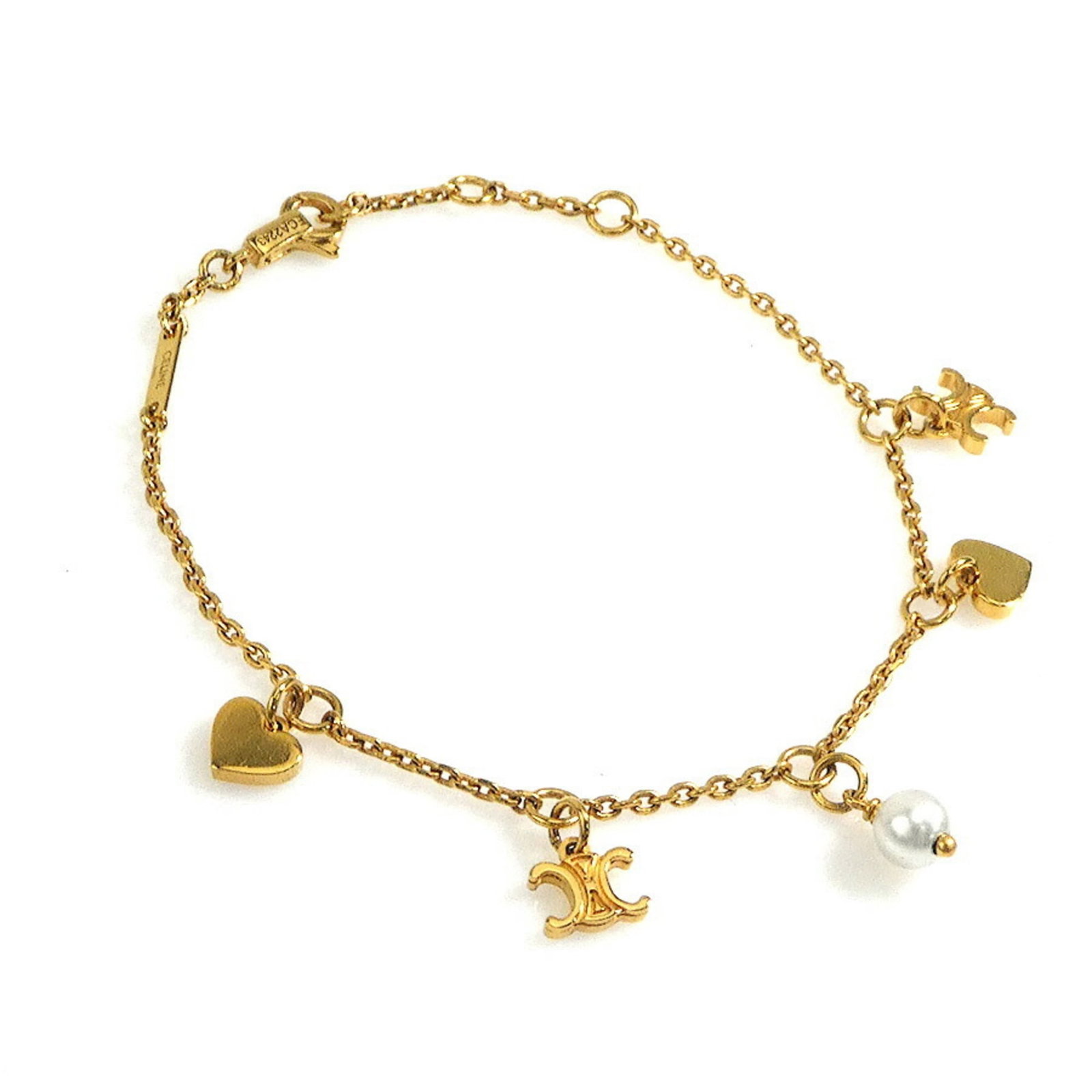 Metal Charm Celine Bracelet: Metal Charm Celine Bracelet Gold metal charm bracelet with a classic Celine design, featuring subtle details and a timeless look. This 14.5-16.5cm / 5.7'' - 6.49'' long charm bracelet is made from