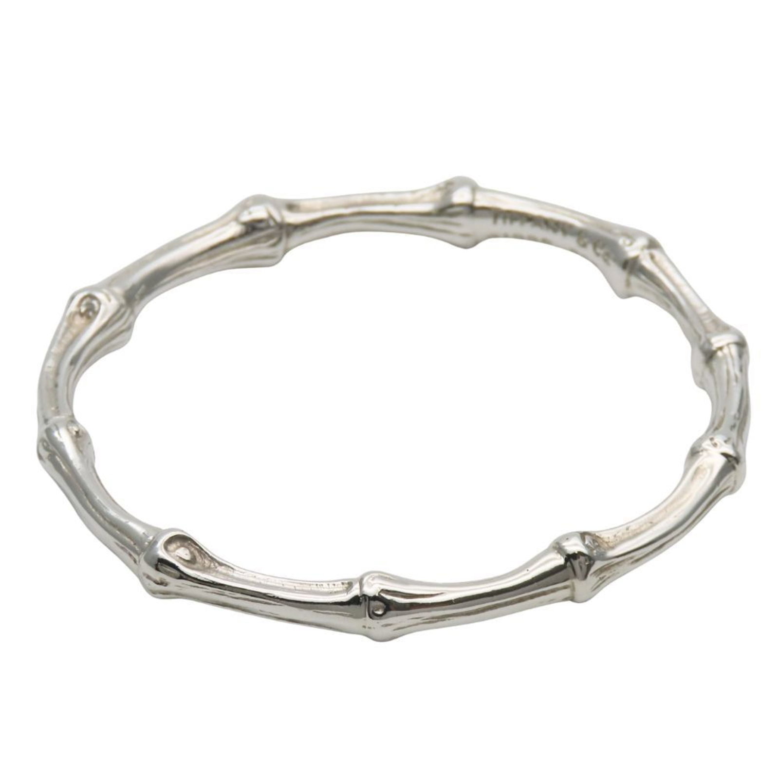 Charm Tiffany Bracelet 925 Silver: Charm Tiffany Bracelet 925 Silver Charm Tiffany Bracelet 925 Silver - A silver charm bracelet in excellent condition, bearing the hallmark of Tiffany Type. The 18cm length features a subtle sheen of 9