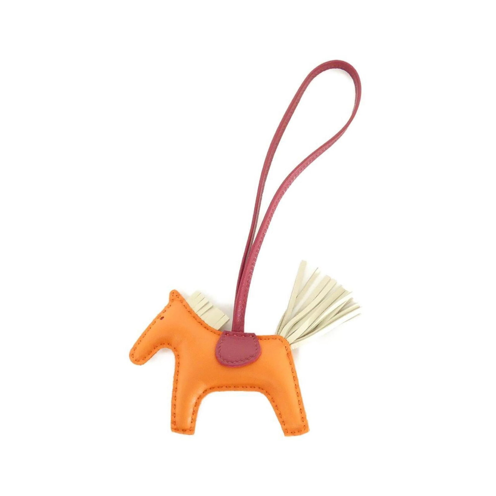 Hermes Handbag Charm Agneau Milo: Hermes Handbag Charm Agneau Milo Agneau Milo handbag charm from Hermes, boasting an eye-catching orange and ruby color combination. Measuring 75mm x 85mm, this small yet striking accessory features a