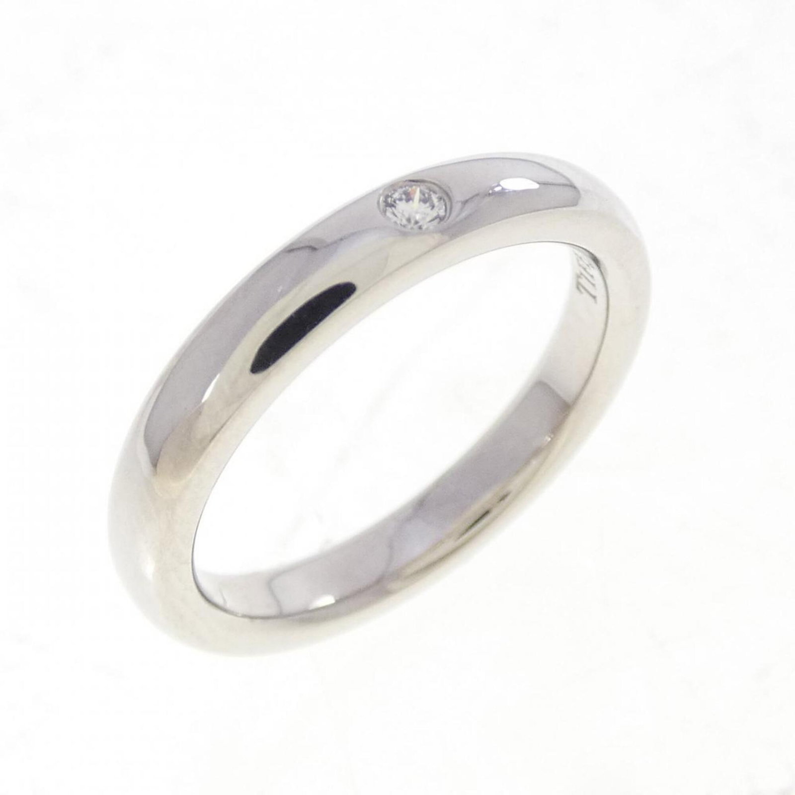Platinum ring by Tiffany band: Platinum ring by Tiffany band Platinum ring by Tiffany features a silver band with a subtle shine, crafted from high-quality platinum. The ring bears some minor scratches and traces of usage, but