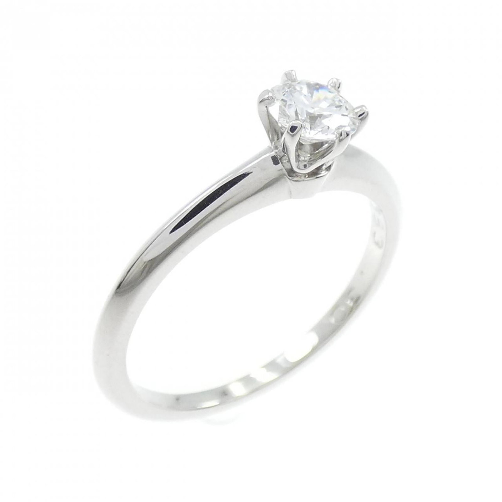 Platinum ring by Tiffany band: Platinum ring by Tiffany band Platinum ring by Tiffany features a diamond stone set in a band ring. The item has some scratches and dirt, but overall remains in very good condition with only a few tra