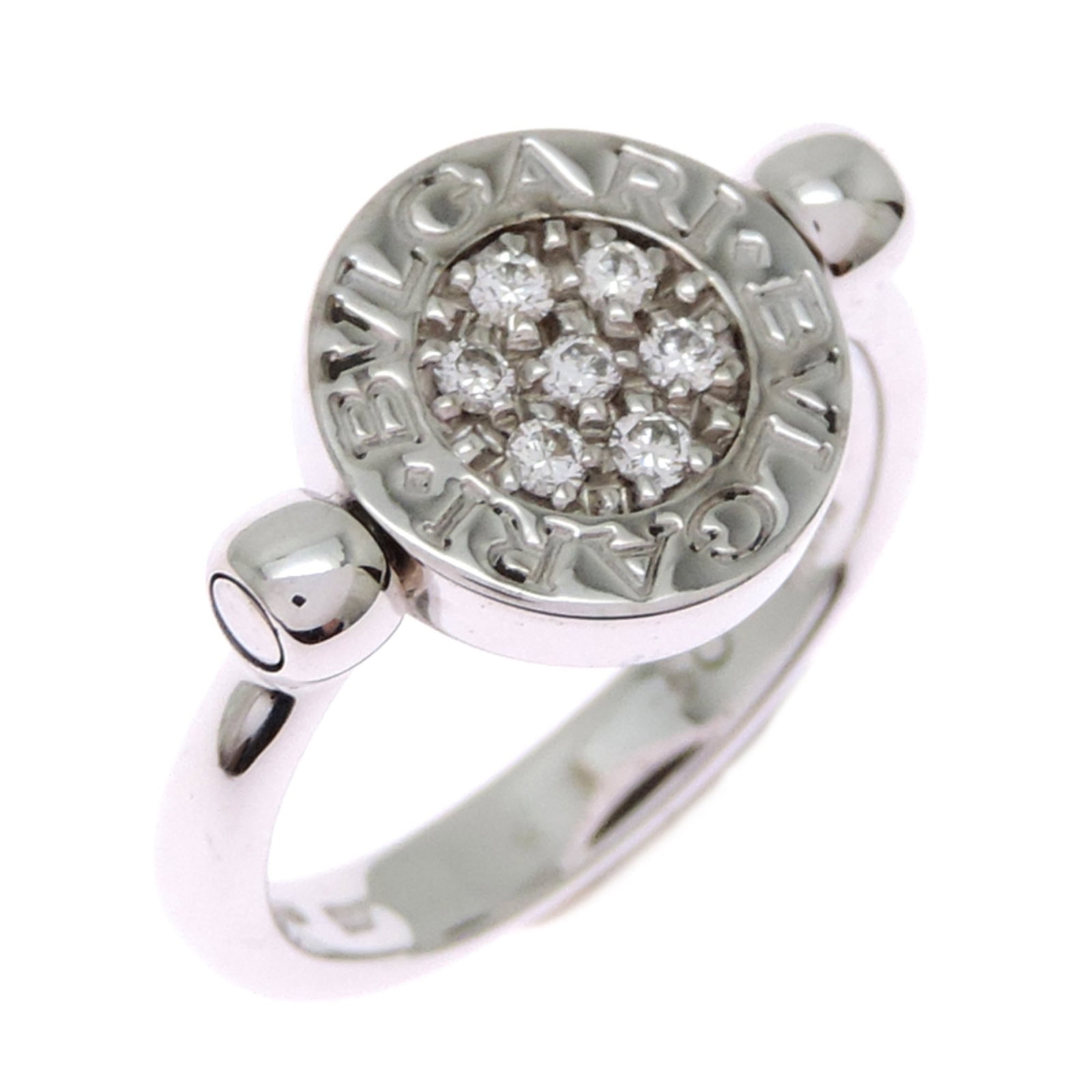 Bvlgari Band Ring White Gold (18K): Bvlgari Band Ring White Gold (18K) Bvlgari Band Ring White Gold (18K) features a sleek design with a diamond and onyx stone, set in high-quality white gold. The ring's 18K material provides
