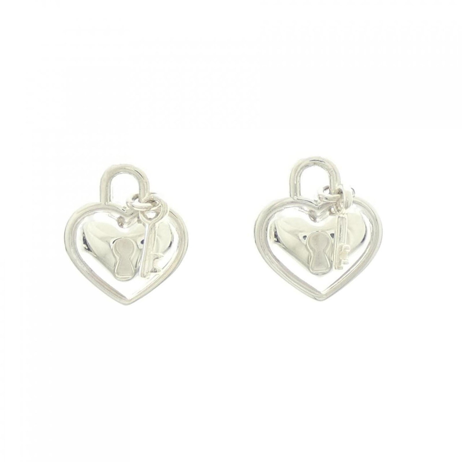 Silver 925 stud earrings by Tiffany: Silver 925 stud earrings by Tiffany Silver 925 stud earrings by Tiffany, featuring a classic design with a subtle sheen. Made from high-quality silver, these earrings showcase a timeless elegance that