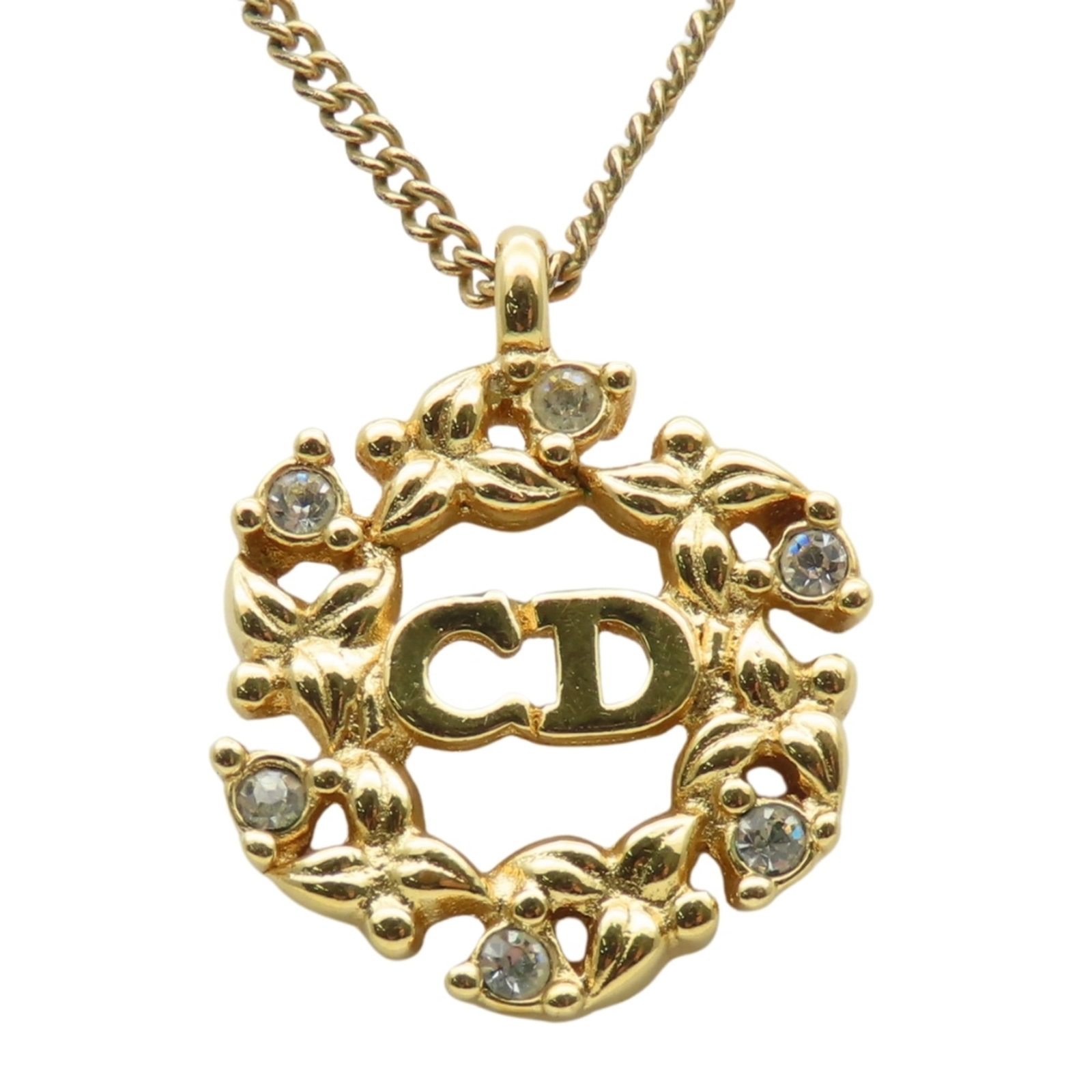 Christian Dior Cd Logo Necklace With Metal Rhinestones In Gold Gp Plating For Women.: Christian Dior Cd Logo Necklace With Metal Rhinestones In Gold Gp Plating For Women. Gold-plated Christian Dior Cd Logo Necklace features metal rhinestones for a touch of luxury. The necklace boasts a