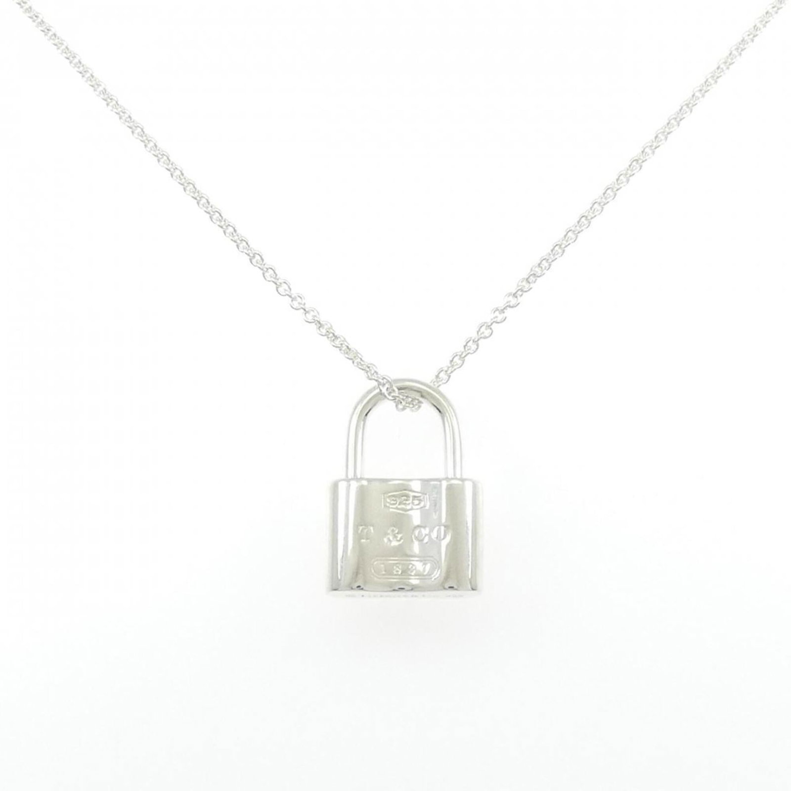 Co Tiffany & 1837 Lock Necklace: Co Tiffany & 1837 Lock Necklace Tiffany & Co. Lock Necklace in sterling silver, featuring a pendant with a 20.5mm x 14.5mm design, set against a 41cm chain. The necklace showcases a classic lock motif