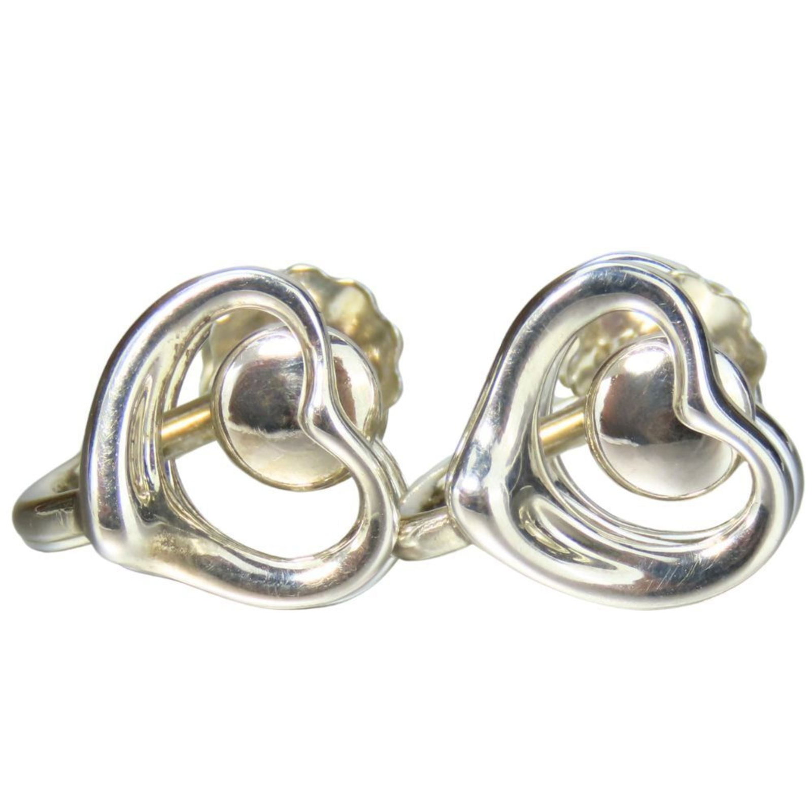 Silver clip earrings Tiffany: Silver clip earrings Tiffany Silver clip earrings with a classic Tiffany design, featuring a sleek and modern silver finish. The intricate details of the clip-on earring are still visible despite some