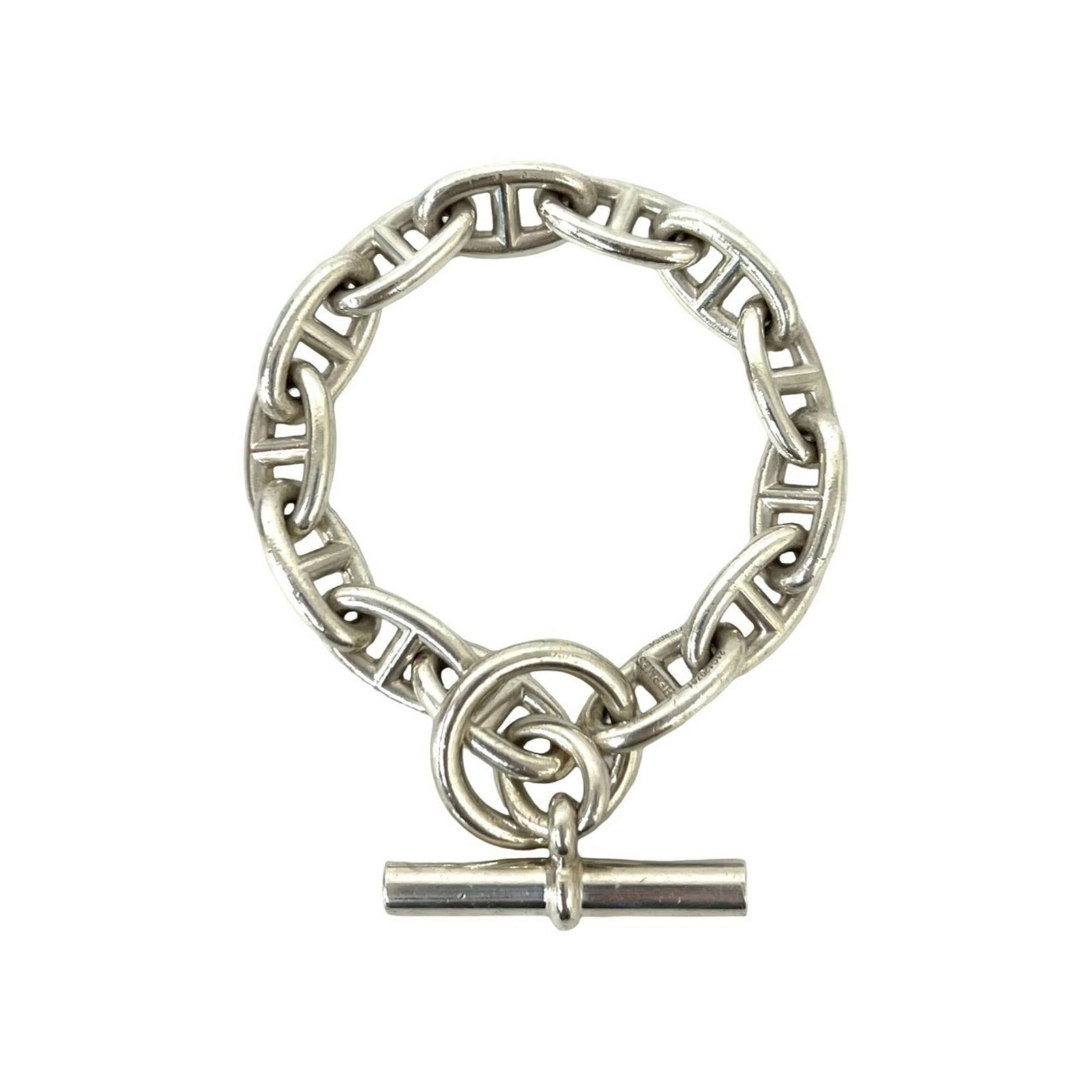 Silver Charm Bracelet 925 by Hermes: Silver Charm Bracelet 925 by Hermes Silver Charm Bracelet by Hermes, 22.2cm in length, made from high-quality silver 925 material, features a classic charm design that adds a touch of elegance to any