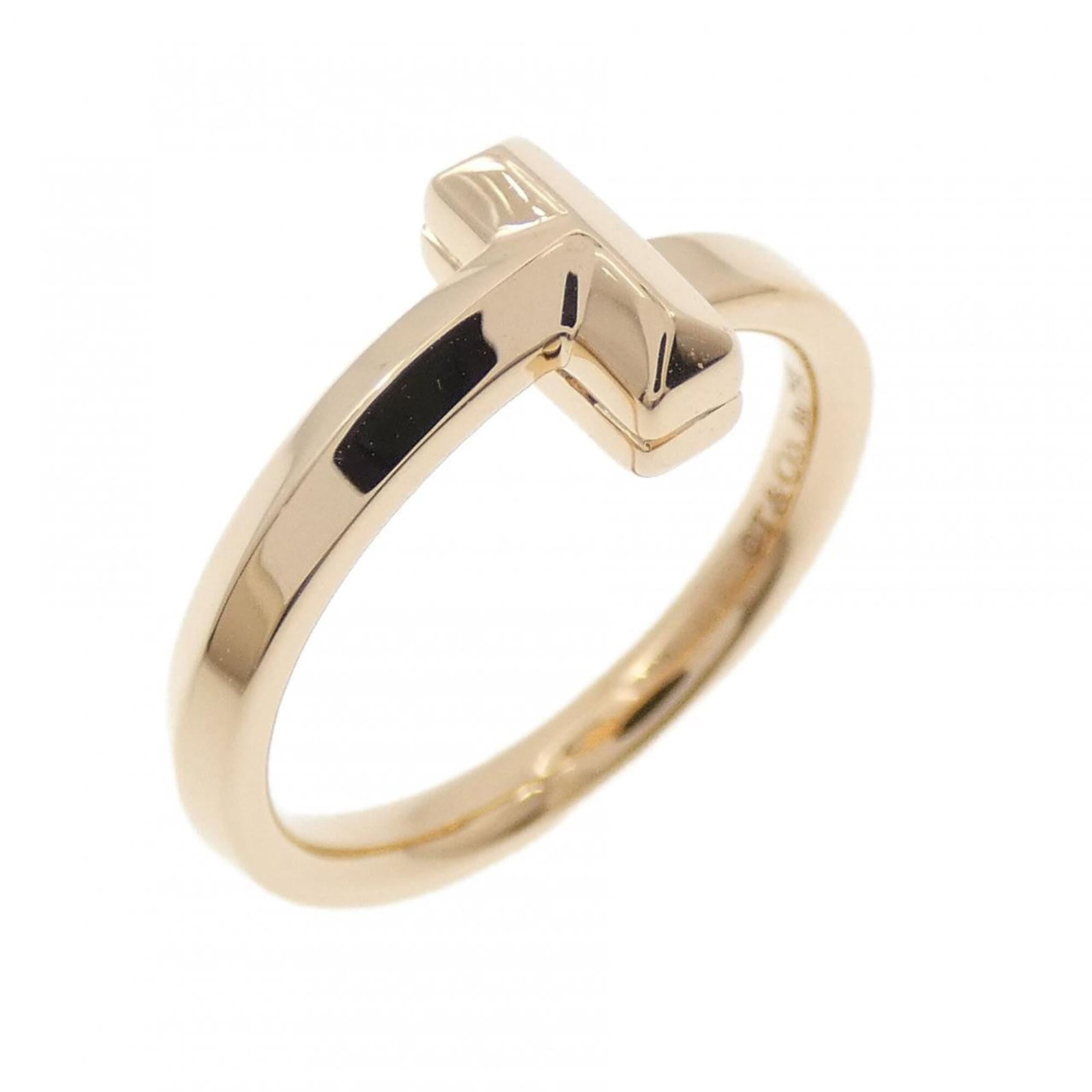 Pink Gold Ring Band Tiffany: Pink Gold Ring Band Tiffany Pink Gold Ring Band from Tiffany, crafted in 18K pink gold, features a classic band design. The piece bears minor signs of usage, including scratches and some dirt, but