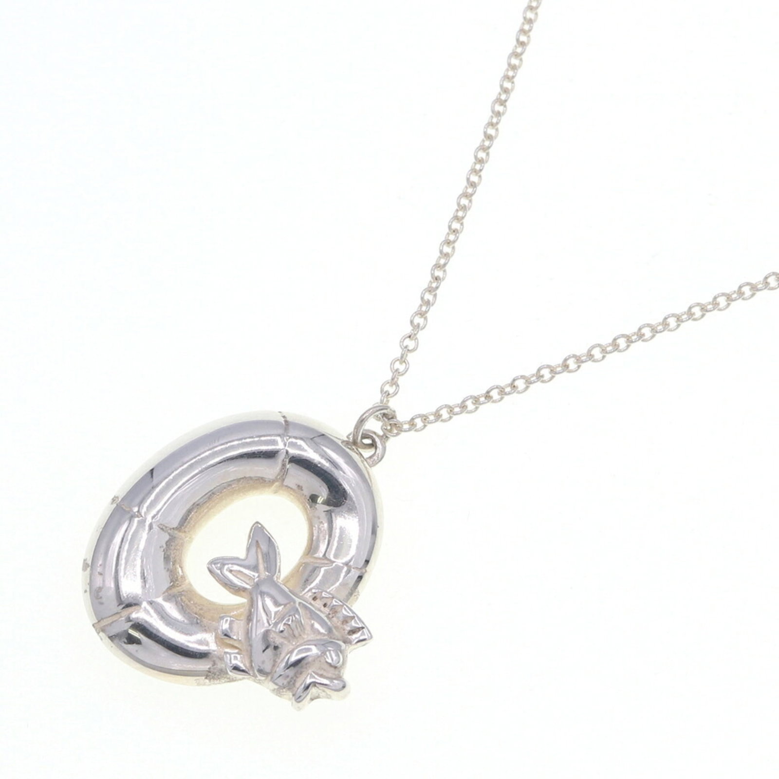 Tiffany sterling silver necklace pendant women's fish with Tiffany & Co.: Tiffany sterling silver necklace pendant women's fish with Tiffany & Co. Sterling silver necklace pendant featuring a women's fish design from Tiffany & Co. This iconic piece boasts the brand's