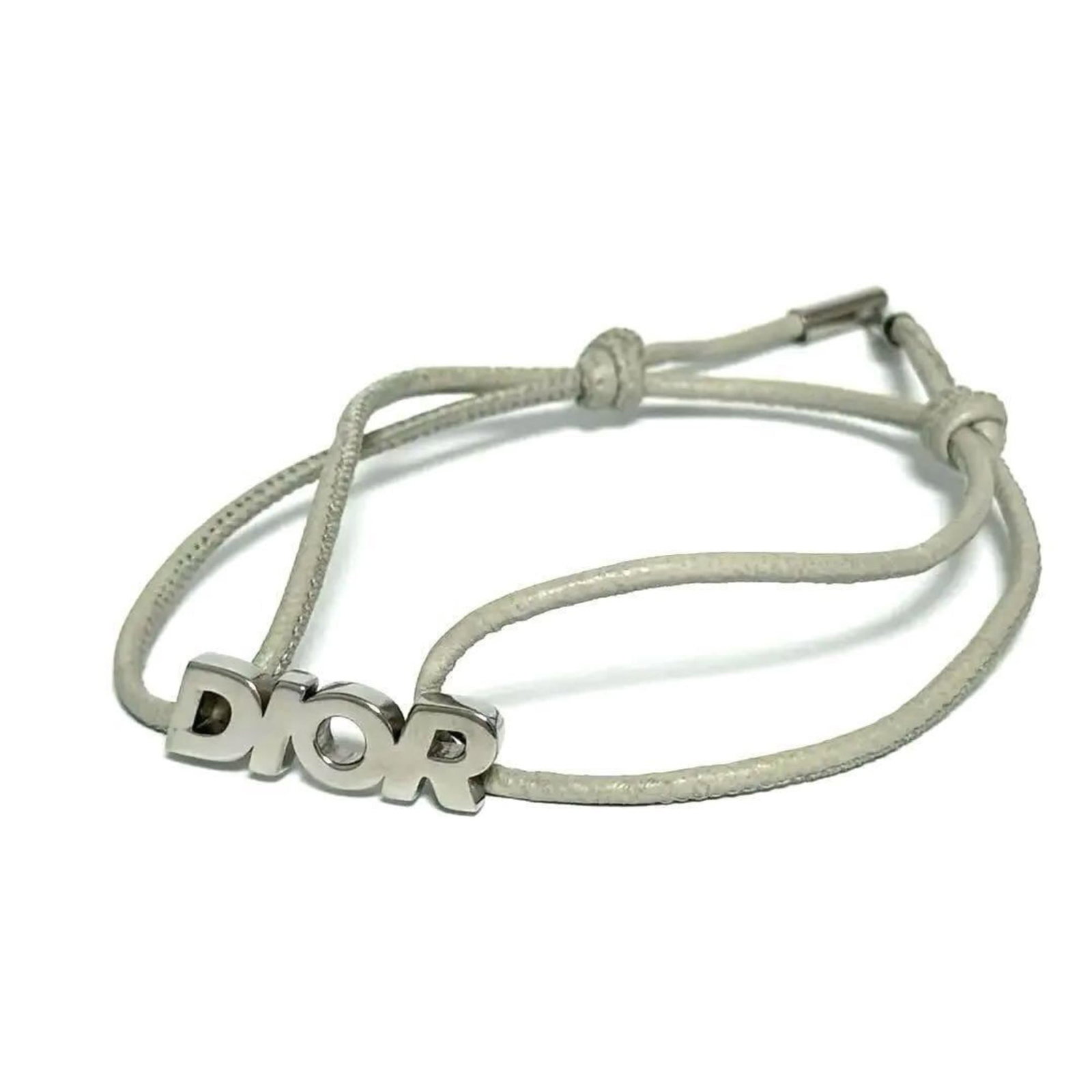 Dior Charm 925 Silver Christian: Dior Charm 925 Silver Christian Silver Charm 925 Dior Christian bracelet with traces of usage and minor scratches, bearing a signature. This 19cm / 7.48'' charm bracelet features the iconic Christian 