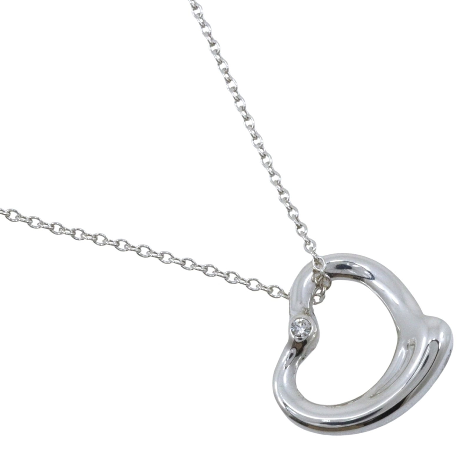 Tiffany & Co. Open Heart Necklace With 2 Diamonds Designed By Elsa Peretti Sterling Silver 925 X: Tiffany & Co. Open Heart Necklace With 2 Diamonds Designed By Elsa Peretti Sterling Silver 925 X Tiffany & Co.'s iconic Open Heart Necklace features a sterling silver 925 design by Elsa Peretti,