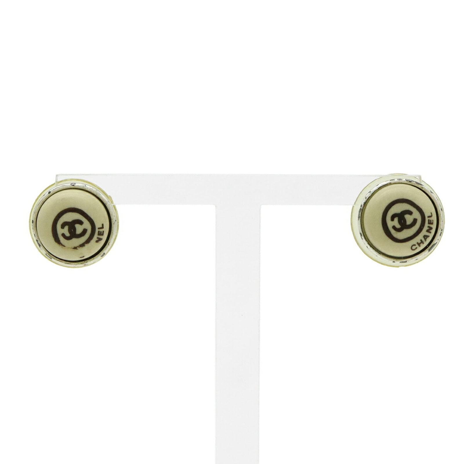 Chanel Stud Earrings Metal Plastic: Chanel Stud Earrings Metal Plastic Chanel Stud Earrings Metal Plastic - A Timeless Classic. Made from metal and plastic, these stud earrings feature the iconic Chanel design in beige and silver hues. 