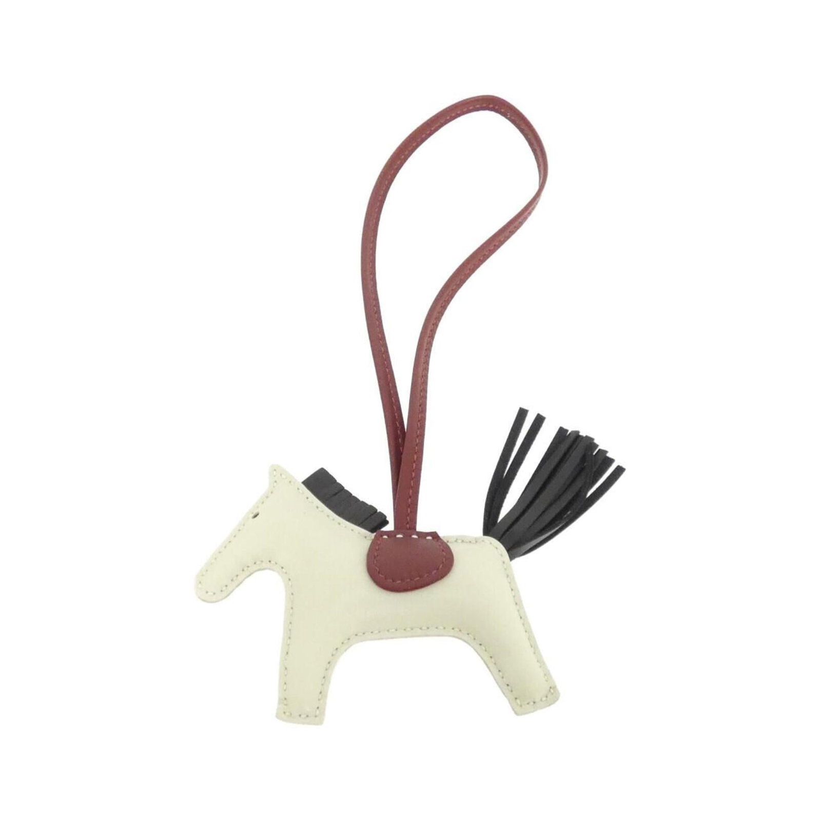 Hermes Handbag Charm Agneau Milo: Hermes Handbag Charm Agneau Milo Agneau Milo, a signature Hermes handbag charm, boasts an ivory finish and measures 75.00mm x 85.00mm in size. The chain length is 360.00mm, adding a touch of elegance