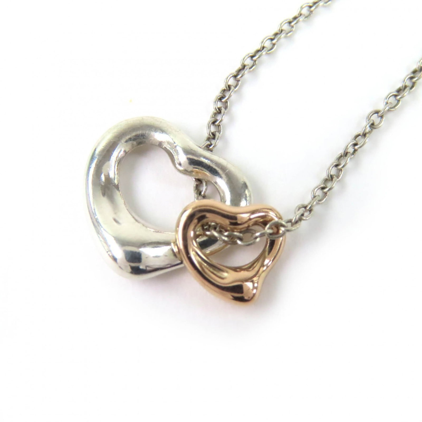 Tiffany&Co. Tiffany & Co. Elsa Peretti Double Open Heart Pendant Necklace 925/ 750 Sterling Silver: Tiffany&Co. Tiffany & Co. Elsa Peretti Double Open Heart Pendant Necklace 925/ 750 Sterling Silver Tiffany & Co.'s Elsa Peretti Double Open Heart Pendant Necklace is a timeless piece, featuring 18K go