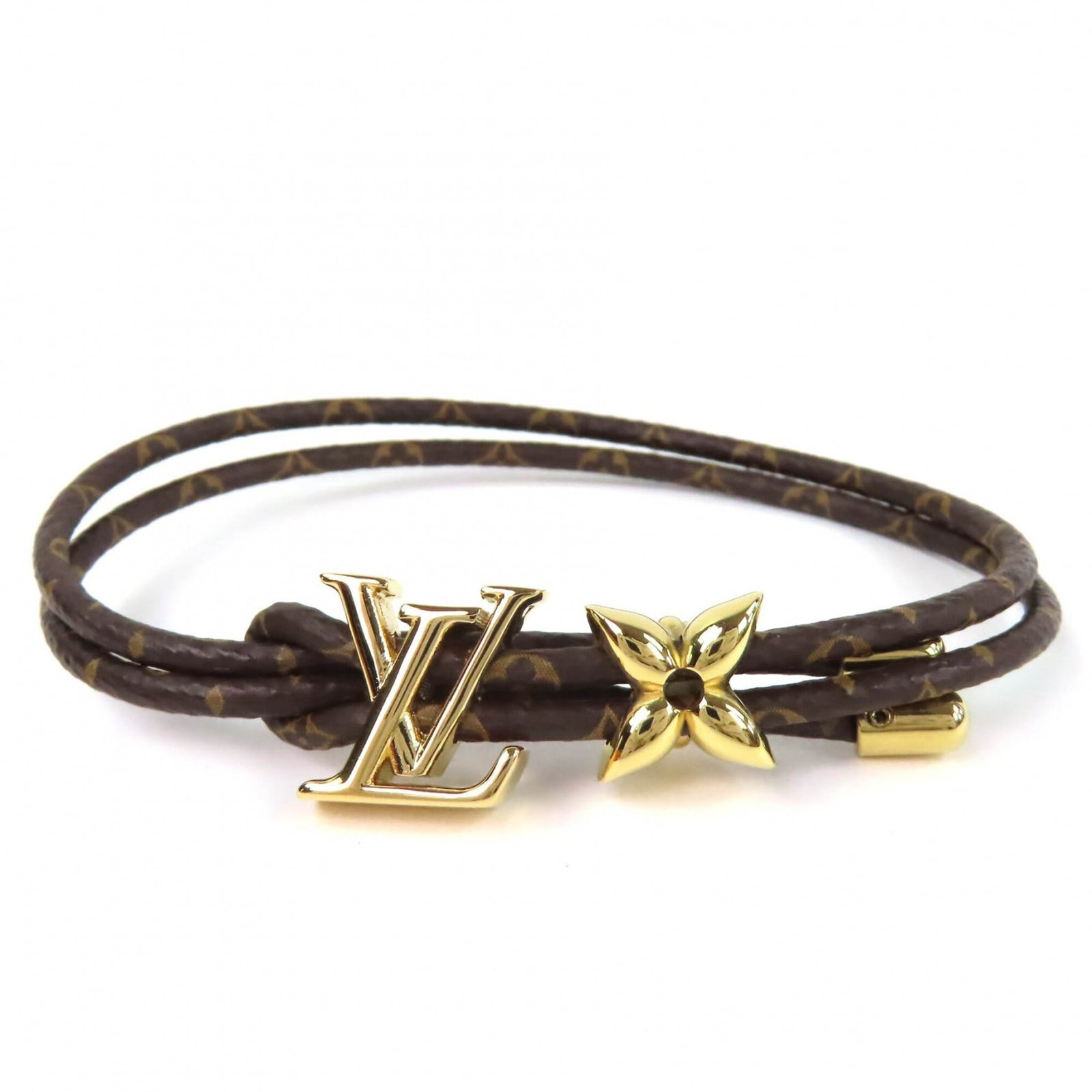 Louis Vuitton Monogram Bracelet: Louis Vuitton Monogram Bracelet Monogram charm bracelet from Louis Vuitton, featuring the iconic monogram pattern in a classic design. The 20cm length provides a versatile fit for everyday wear. With