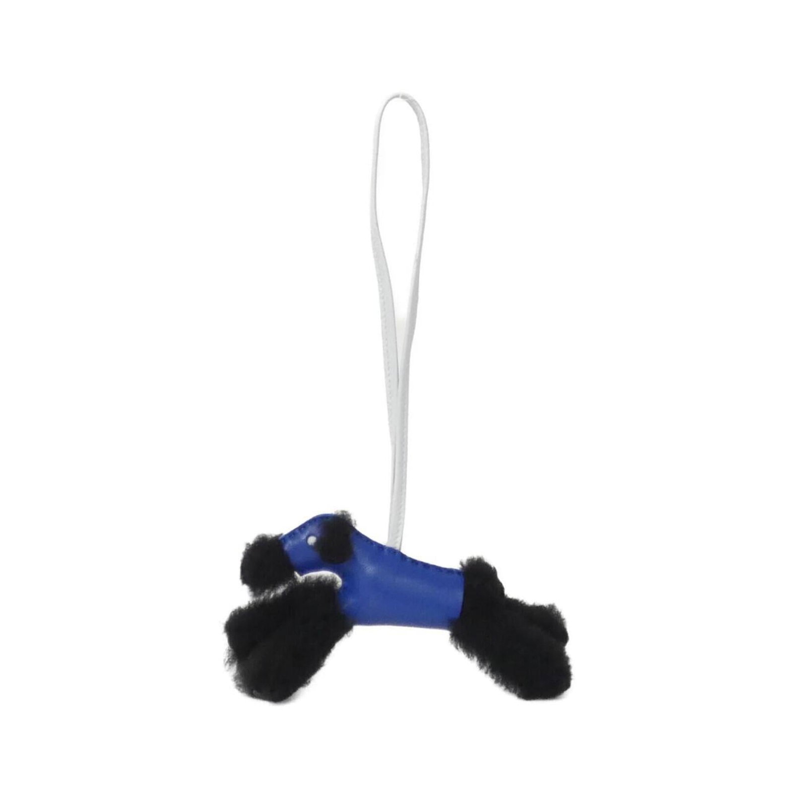 Hermes handbag leather agneau charm: Hermes handbag leather agneau charm Agneau leather charm from Hermes features a sleek, black and blue mouton design. Made from high-quality Agneau Milo leather, this charming accent adds a touch of so