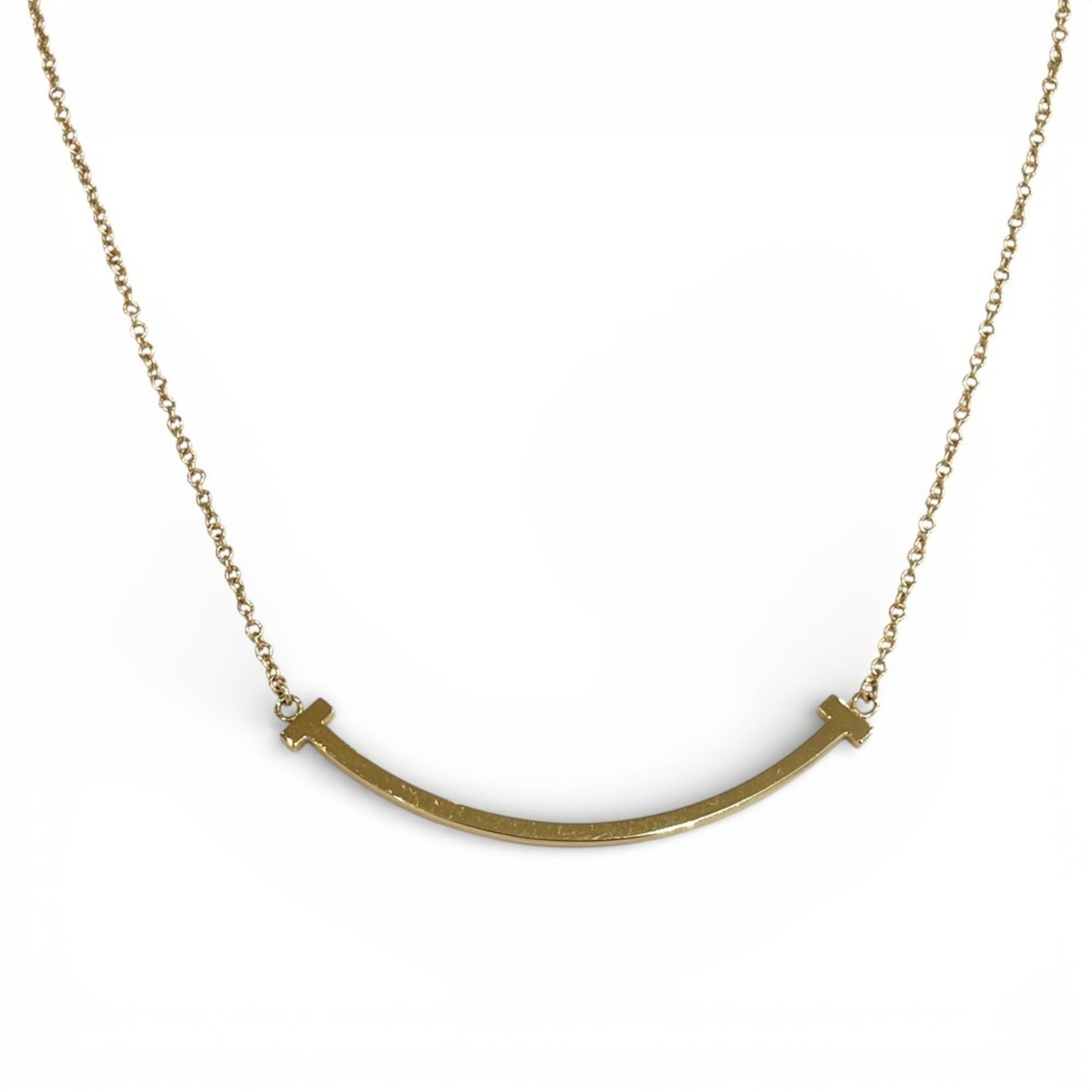 Tiffany & Co. Au750 18K T Smile Small Necklace In Pink Gold For Women: Tiffany & Co. Au750 18K T Smile Small Necklace In Pink Gold For Women Tiffany & Co. Au750 18K T Smile Small Necklace In Pink Gold For Women - A timeless piece of elegance, this 18k pink gold necklace 
