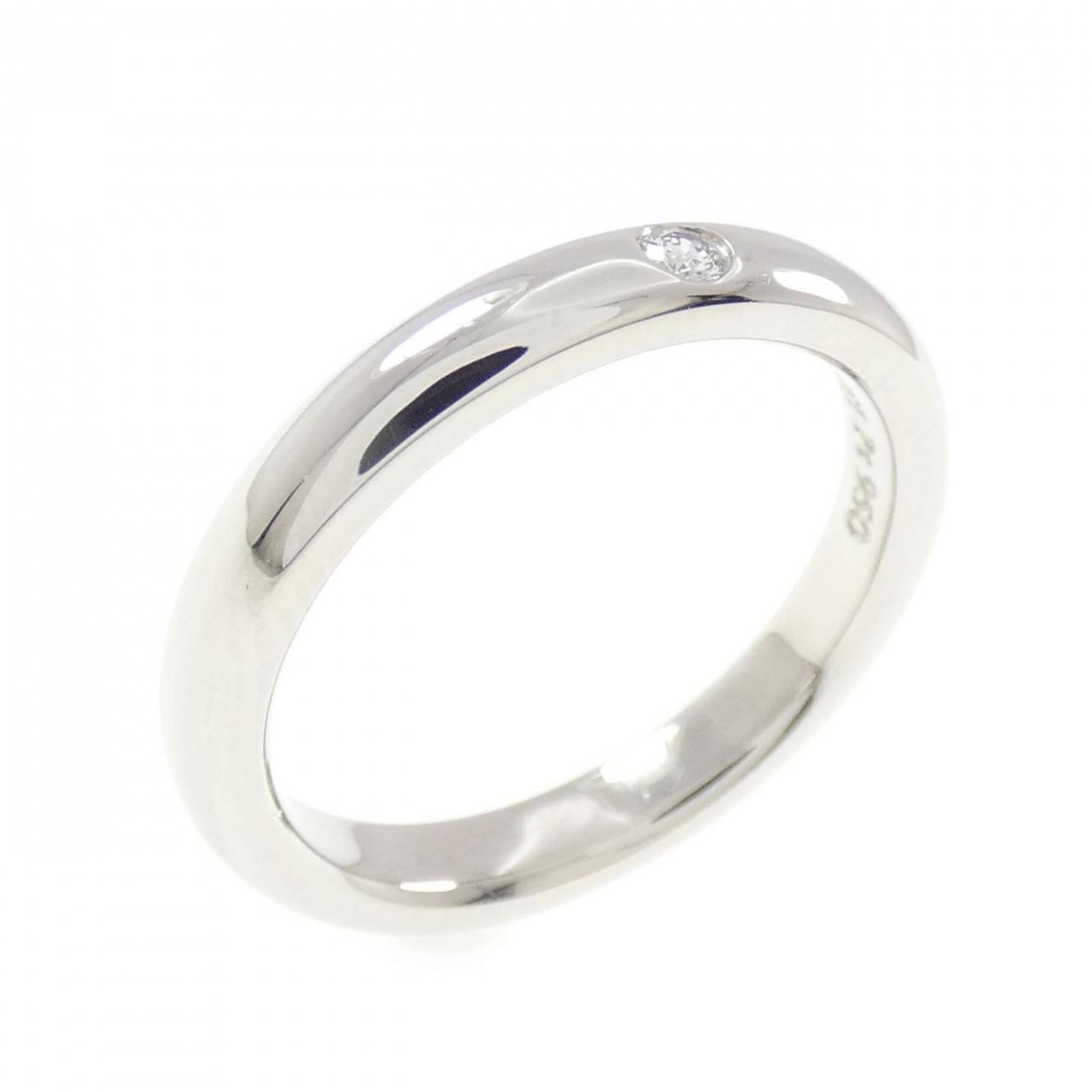 Platinum ring by Tiffany band: Platinum ring by Tiffany band Platinum ring by Tiffany features a band style design made from high-quality platinum. The item shows signs of usage, with a few scratches and dirt visible, but remains