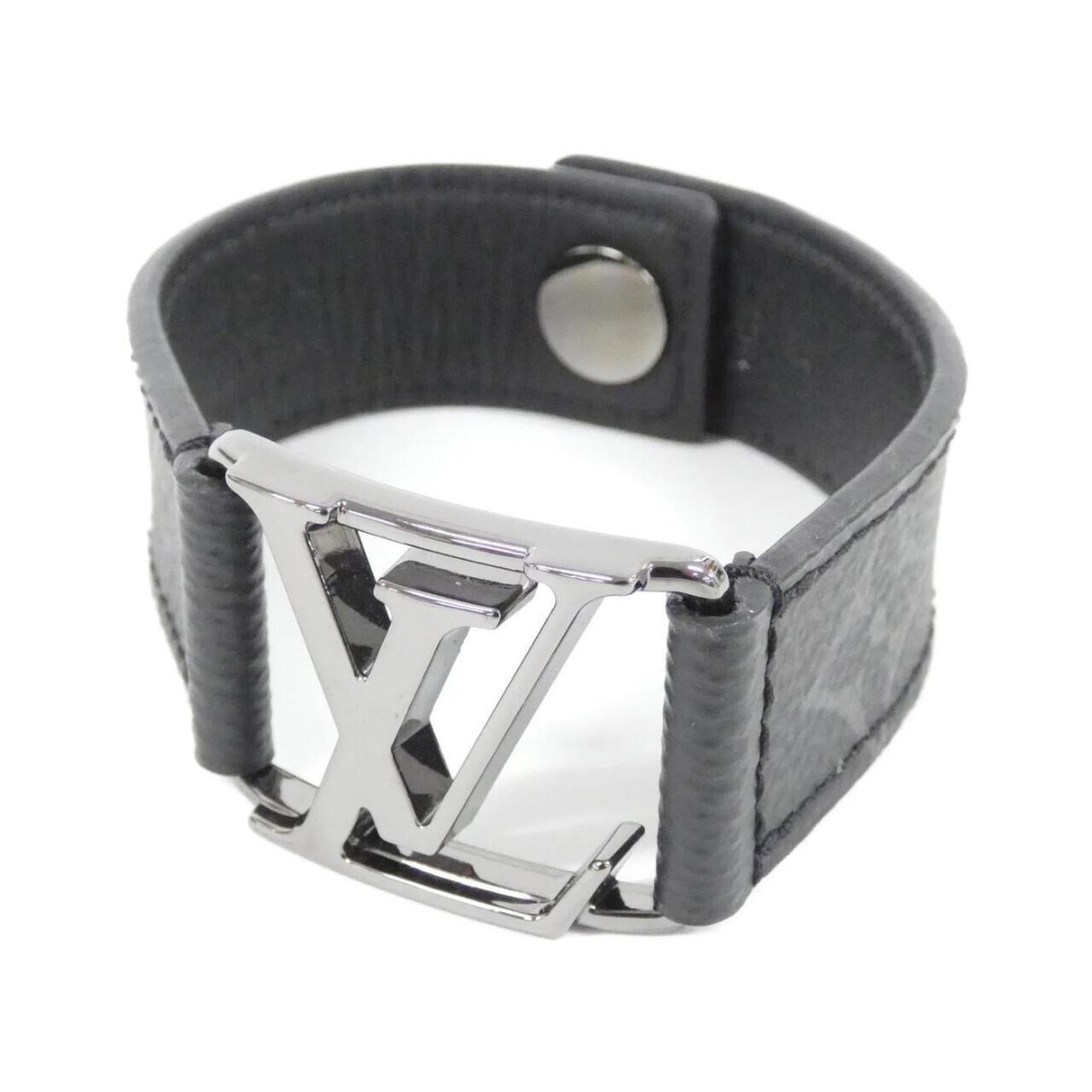 Louis Vuitton Charm Bracelet Canvas: Louis Vuitton Charm Bracelet Canvas Canvas charm bracelet in black from Louis Vuitton, featuring a classic design with some traces of usage and minor scratches. The canvas material gives it a unique t
