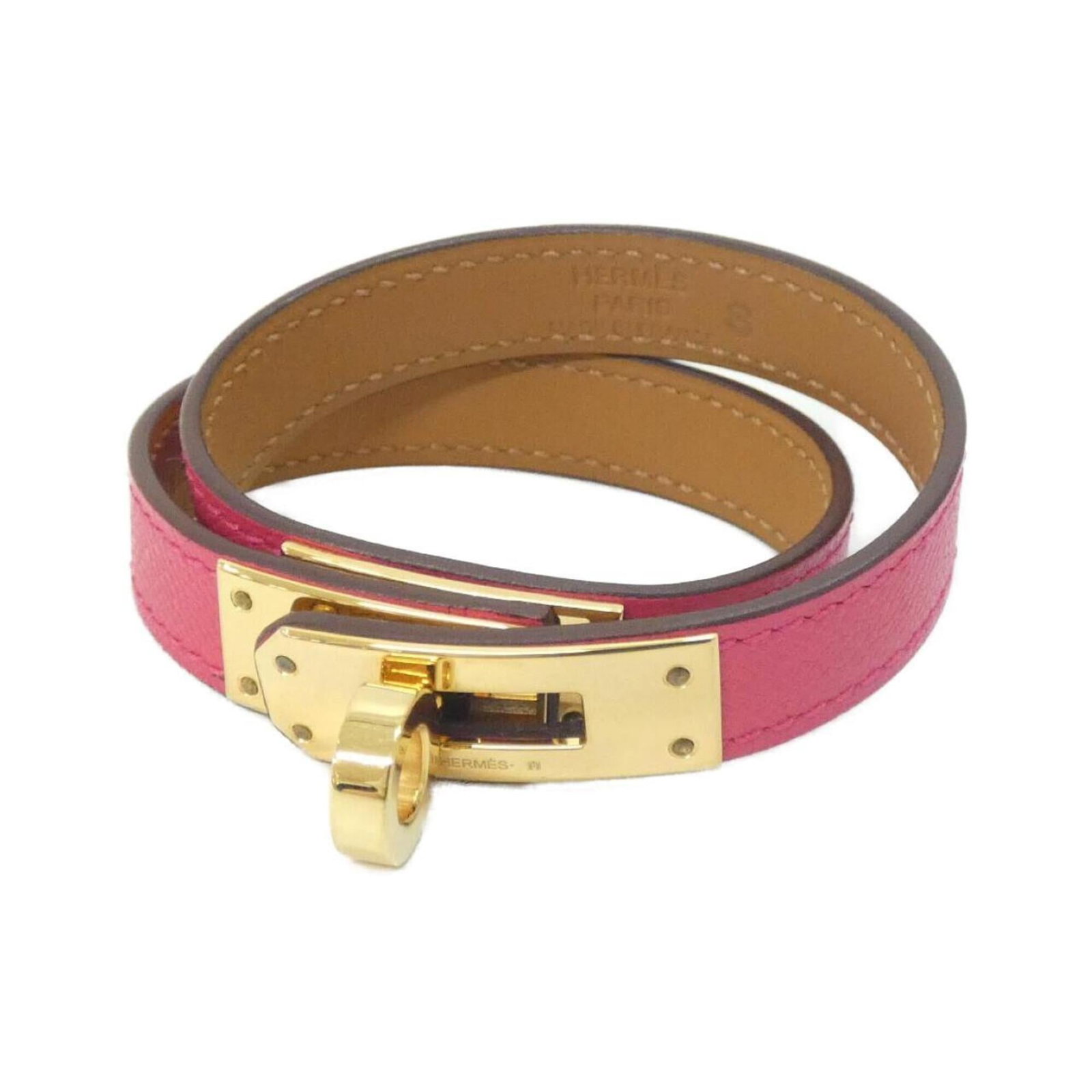 Charm Bracelet by Hermes: Charm Bracelet by Hermes Gold and pink charm bracelet by Hermes, measuring 15cm in length. The used condition shows some traces of usage with minor scratches and dirt, but overall remains in very good