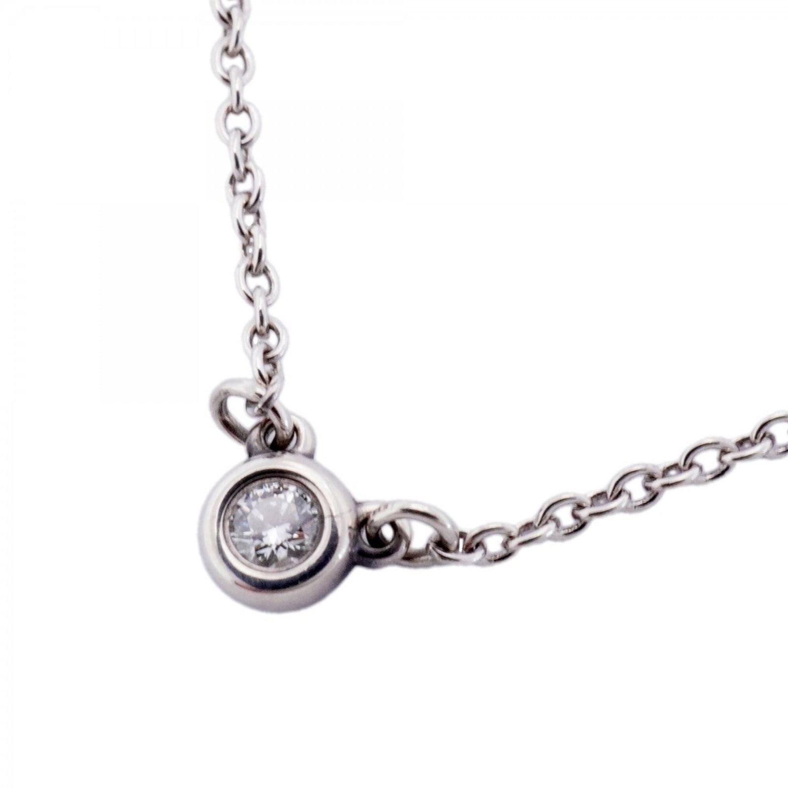 Tiffany Co by women's one diamond sterling silver yard necklace 1pd: Tiffany Co by women's one diamond sterling silver yard necklace 1pd Sterling silver Tiffany & Co. necklace features a one diamond pendant, measuring 4.4mm x 4.7mm, suspended from a 42 cm chain. The ne
