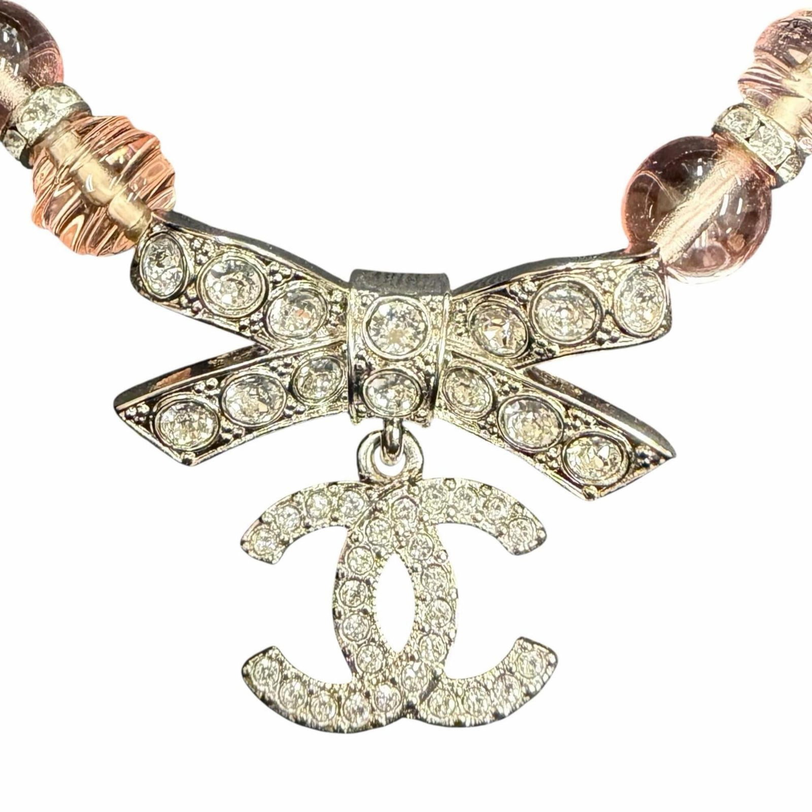 Women's Coco Mark Ribbon Choker Necklace Pink Silver With Italy Made In Box Chanel B23S: Women's Coco Mark Ribbon Choker Necklace Pink Silver With Italy Made In Box Chanel B23S Pink Silver Choker Necklace with Italy Made In Box from Chanel. This used, like new choker features a 28mm x 30m