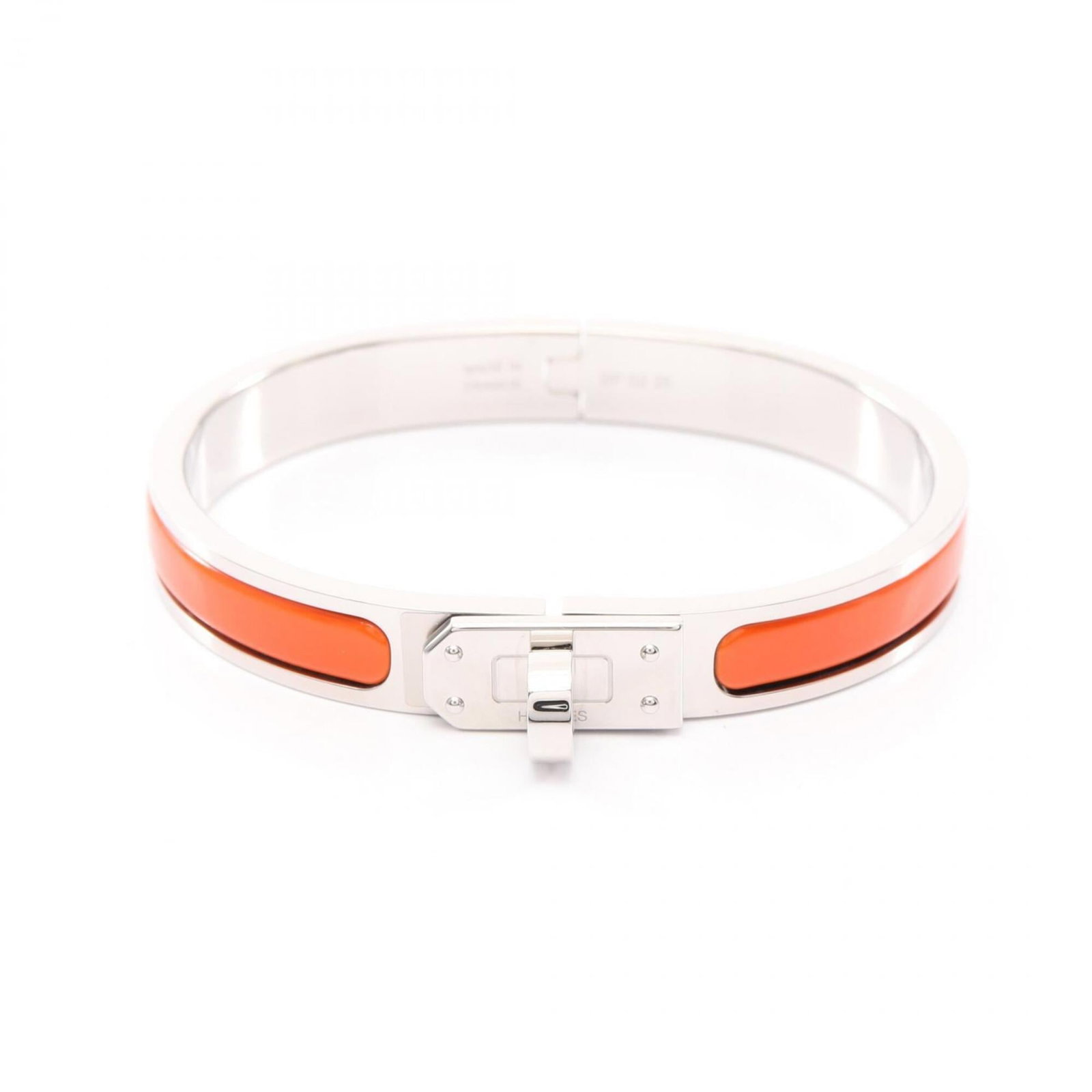 Hermes charm bracelet enamel stainless steel: Hermes charm bracelet enamel stainless steel Enamel and stainless steel charm bracelet from Hermes, featuring vibrant orange enamel accents and a silver finish. This opened, never-used piece