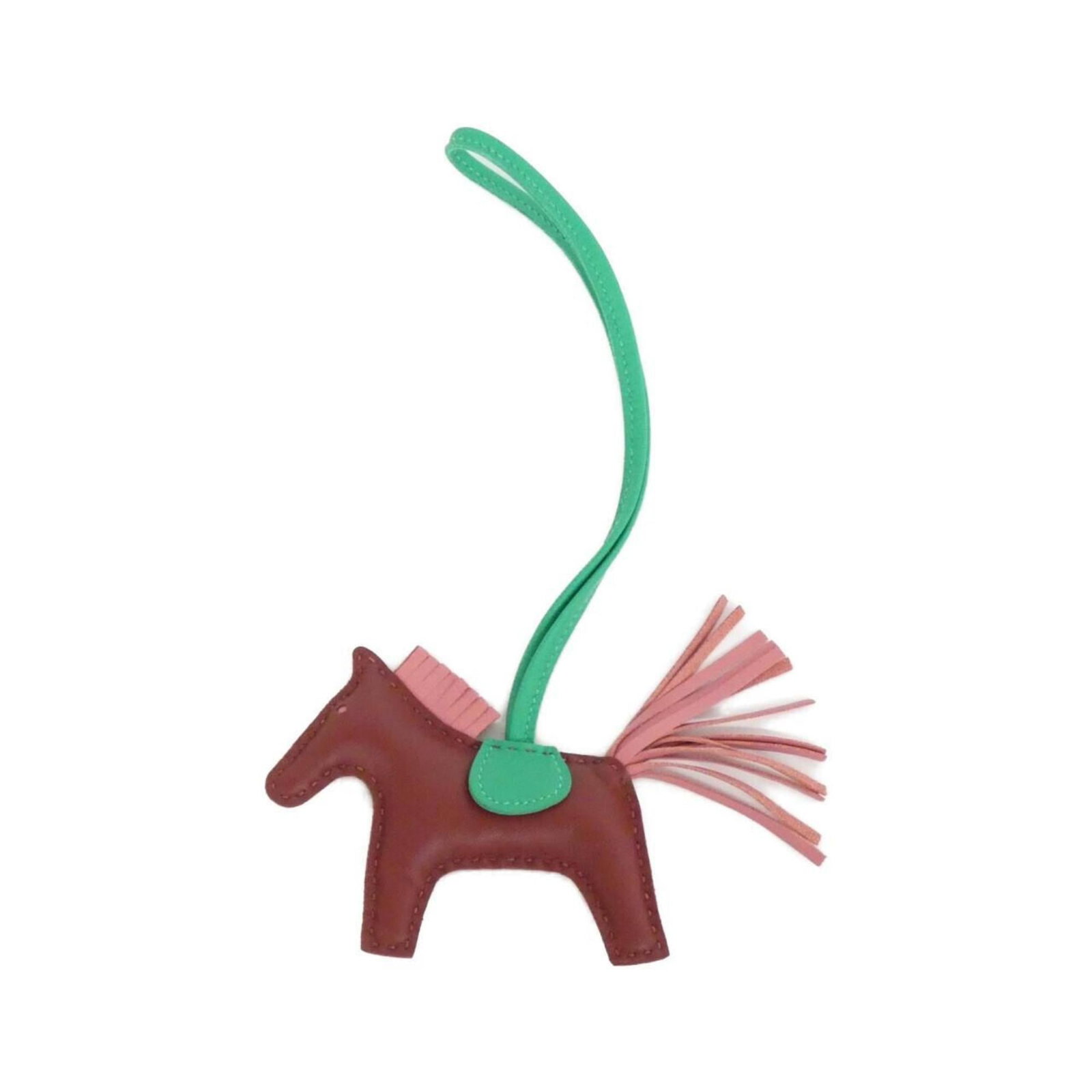 Hermes Handbag Charm Agneau Milo: Hermes Handbag Charm Agneau Milo Agneau Milo charm from the iconic Hermes handbag collection, featuring a mint green and rouge color combination. This used charm boasts a unique design with some