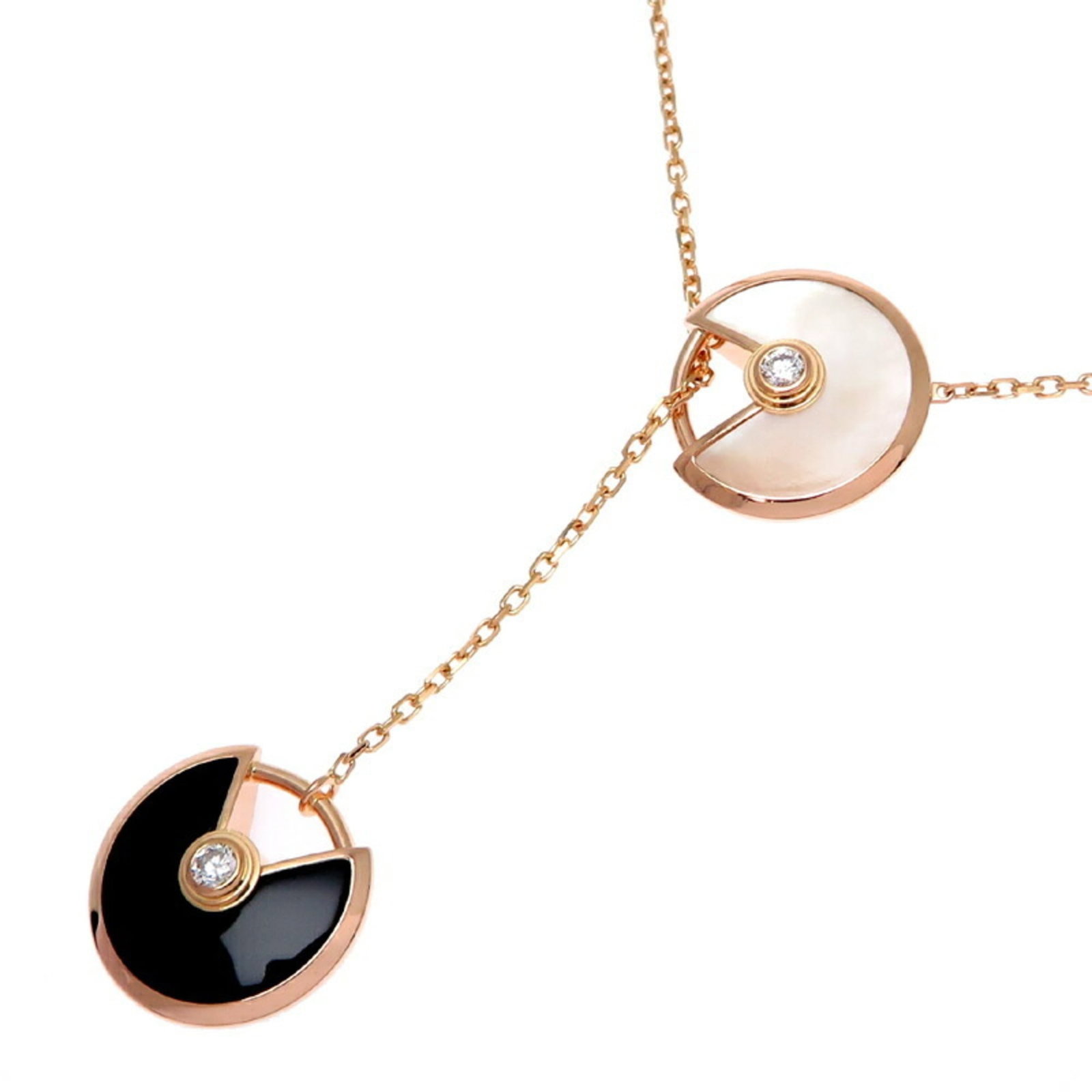 Women's 750 Pink Gold Cartier Necklace B7224569: Women's 750 Pink Gold Cartier Necklace B7224569 Pink gold Cartier necklace with diamond and onyx accents, featuring a 60 cm chain and 11mm x 12mm pendant. This 18K pink gold piece boasts subtle