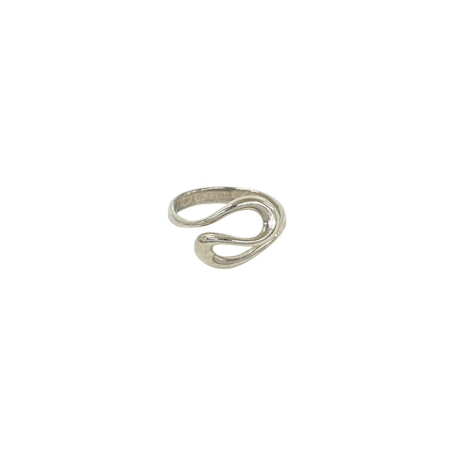 Tiffany Band Ring Silver 925: Tiffany Band Ring Silver 925 Silver band ring from Tiffany, made from sterling silver (925). The ring bears the signature of its creator and has been used, with some signs of wear visible. Overall, it
