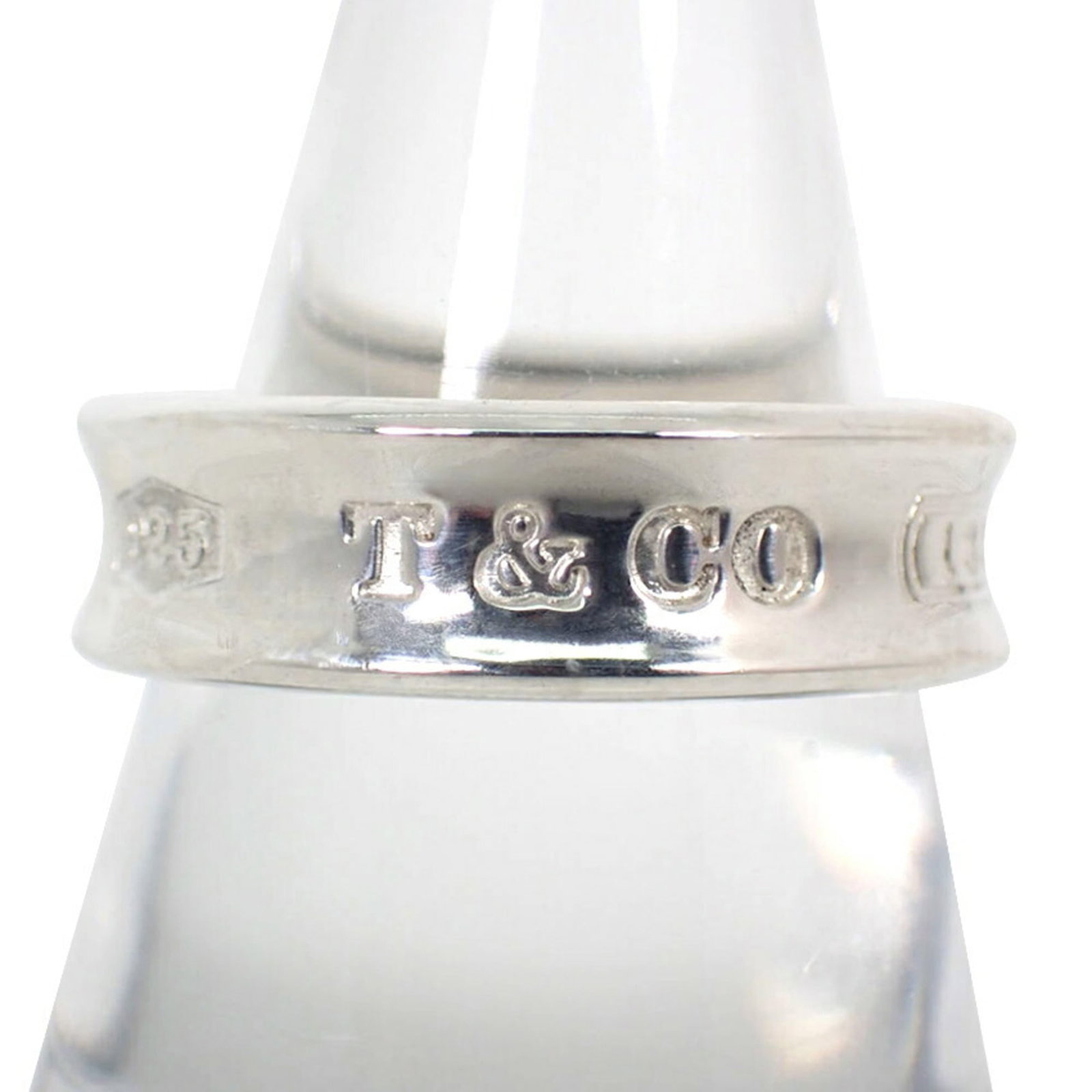 Sterling Silver Ring Tiffany Band: Sterling Silver Ring Tiffany Band Sterling silver ring with Tiffany band design, featuring a classic style and elegant look. The ring bears a signature but its origin is unknown. Made from high-qualit