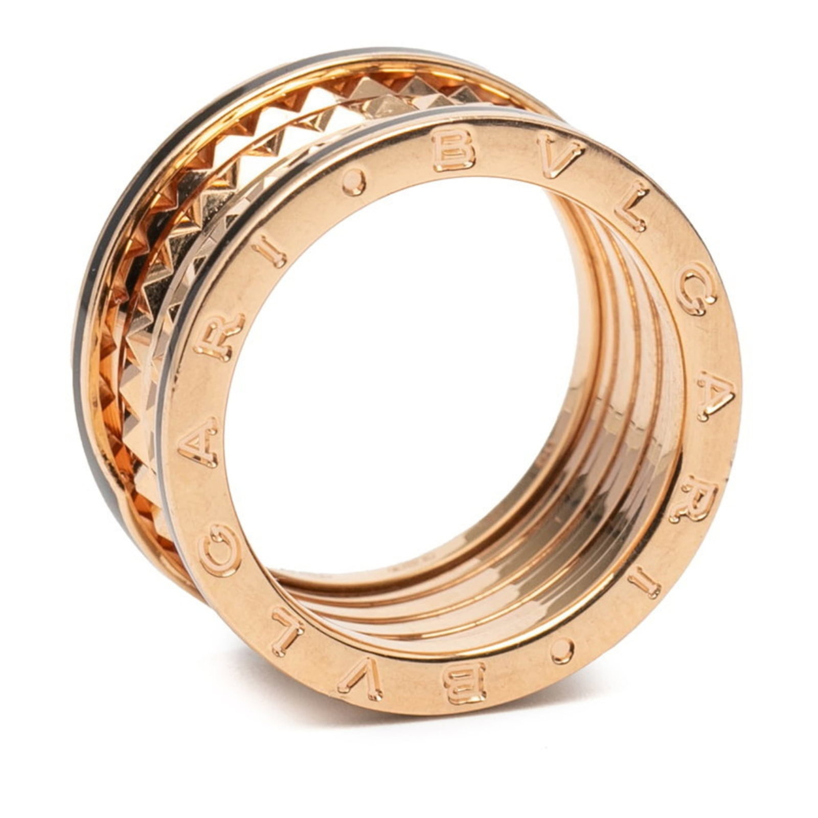 Pink Gold Ceramic Band Ring By Bvlgari: Pink Gold Ceramic Band Ring By Bvlgari Pink Gold Ceramic Band Ring By Bvlgari features a striking pink gold ceramic design, with a black finish and 18K pink gold details. This unique band ring boasts 