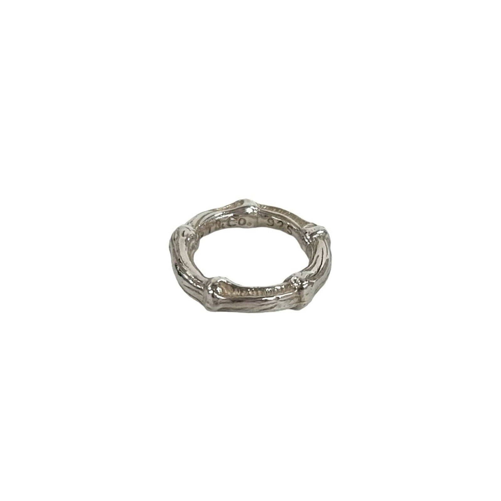 Tiffany Band Ring Silver 925: Tiffany Band Ring Silver 925 Silver band ring from Tiffany, made from sterling silver (925). The ring bears the signature of its creator and has been used, with some signs of wear visible. Overall,