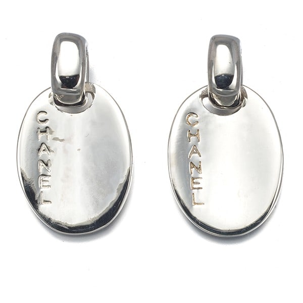 Sterling silver earrings by Chanel: Sterling silver earrings by Chanel Sterling silver earrings by CHANEL, crafted from 925 metal and featuring a stud style with no stone. The sleek design showcases the brand's signature elegance. A tim