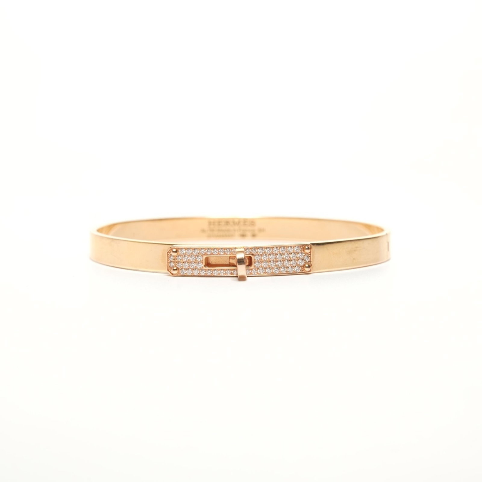Charm Bracelet by Hermes: Charm Bracelet by Hermes 18K gold charm bracelet from renowned luxury brand Hermes, featuring a diamond stone. The delicate 16.5cm length showcases the intricate craftsmanship and attention to detail