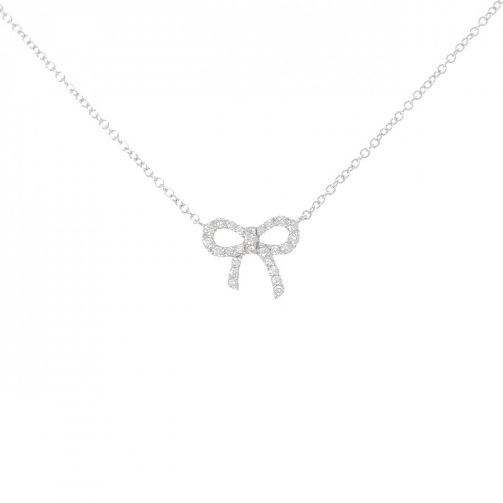 Mini Bow Necklace Metro Tiffany: Mini Bow Necklace Metro Tiffany White gold (18K) pendant features a diamond, set in a classic Metro Tiffany design. The necklace measures 41 cm in circumference and the pendant itself is 9.2mm x 10.7m