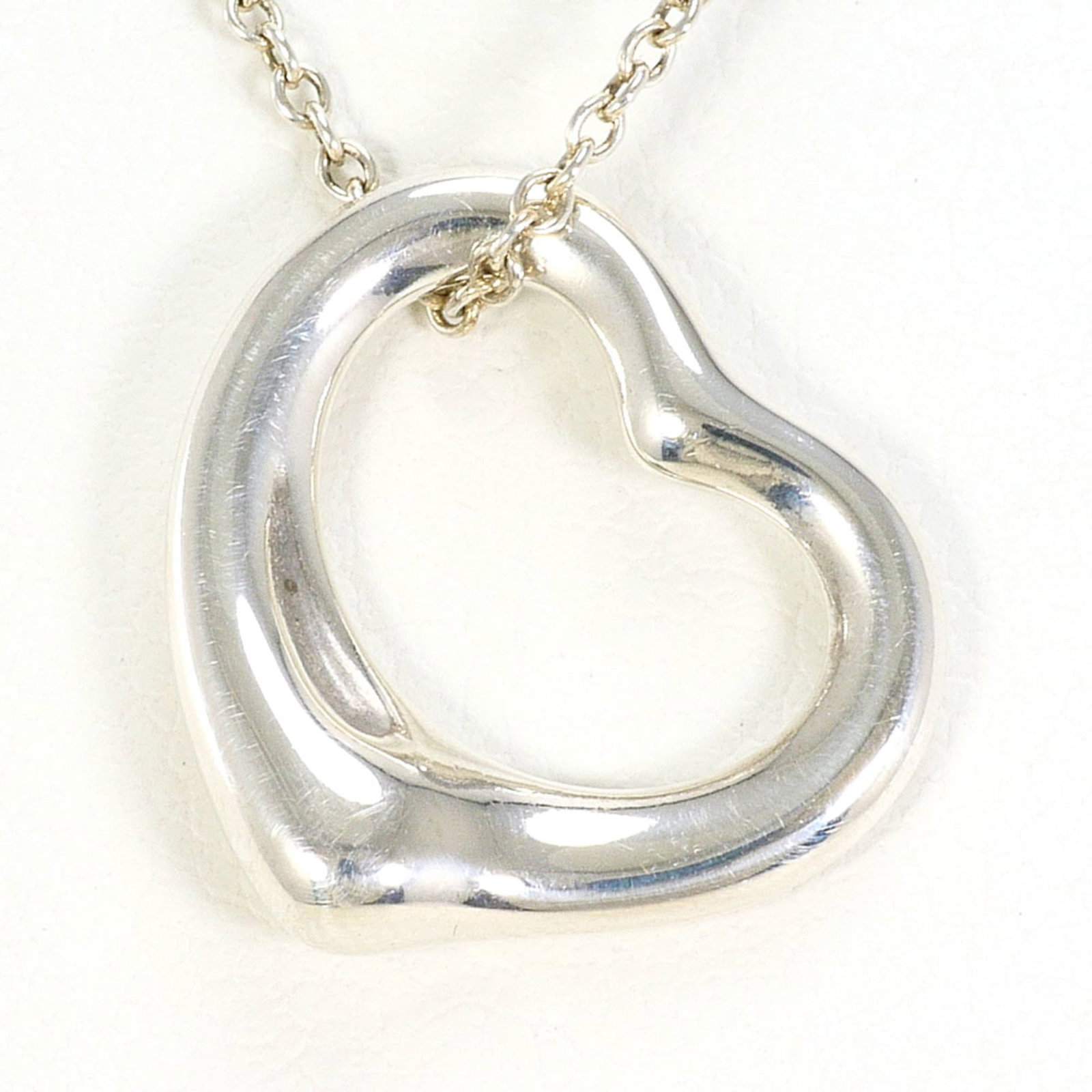 Tiffany & Co. Open Heart Sterling Silver Necklace Approx. 16.5 Inches (41Cm) Total Weight: 2.8G.: Tiffany & Co. Open Heart Sterling Silver Necklace Approx. 16.5 Inches (41Cm) Total Weight: 2.8G. Tiffany & Co. Open Heart Sterling Silver Necklace boasts an elegant design with a 14mm x 15mm pendant,