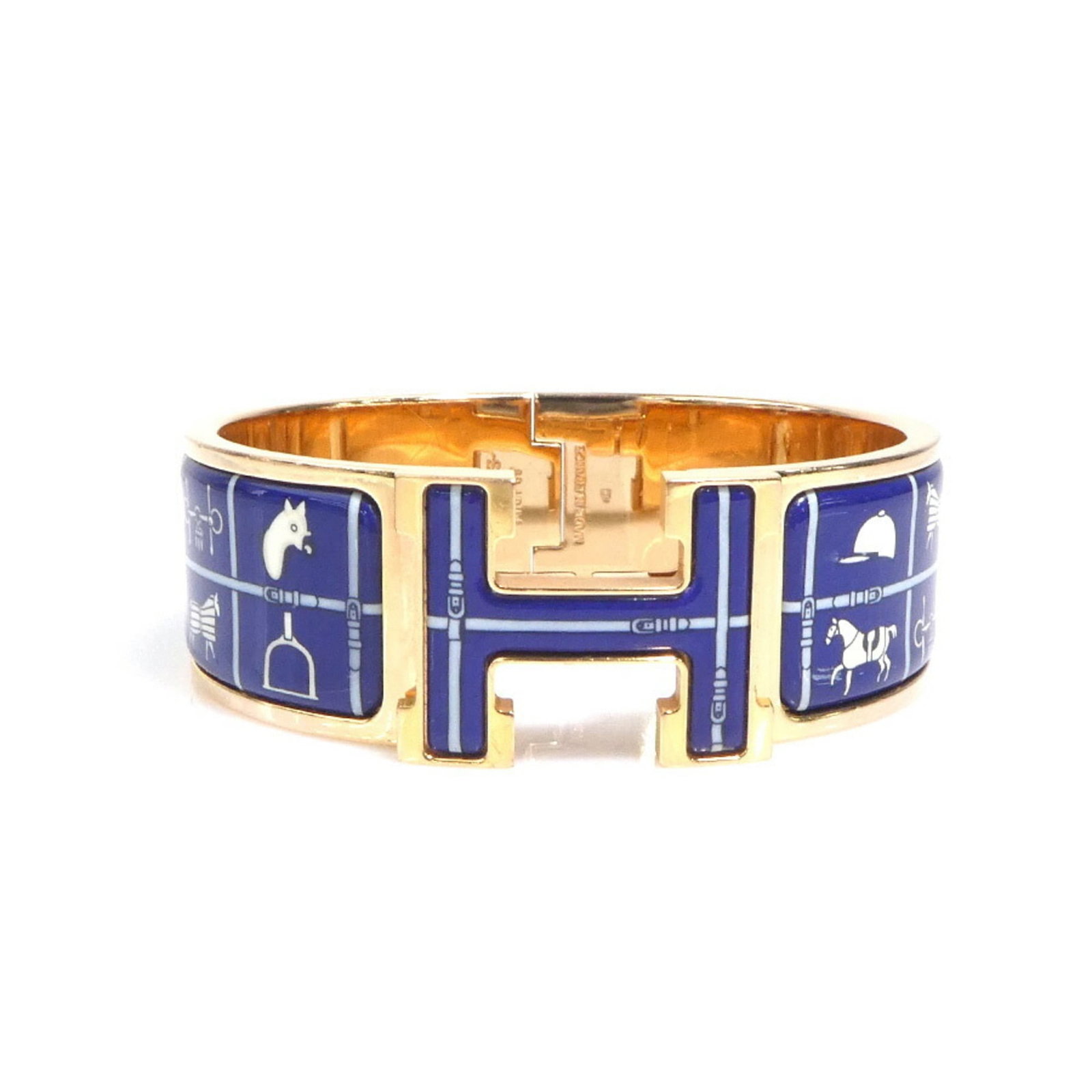 Metal enamel bangle by Hermes: Metal enamel bangle by Hermes The Hermes metal enamel bangle boasts a striking blue, gold, and off-white color scheme in its unique design. With an enamel finish and metal construction, this bangle sh